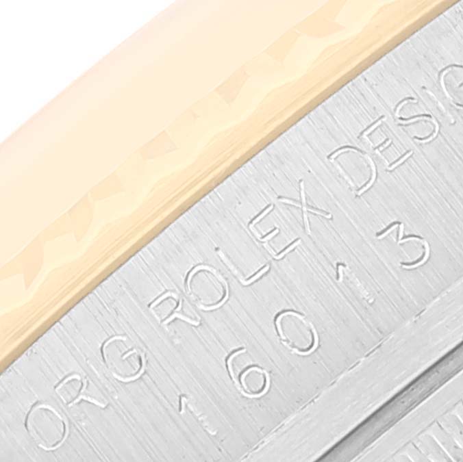 This close-up image shows the engraved model number and part of the bezel of the Vintage Collection by Rolex.