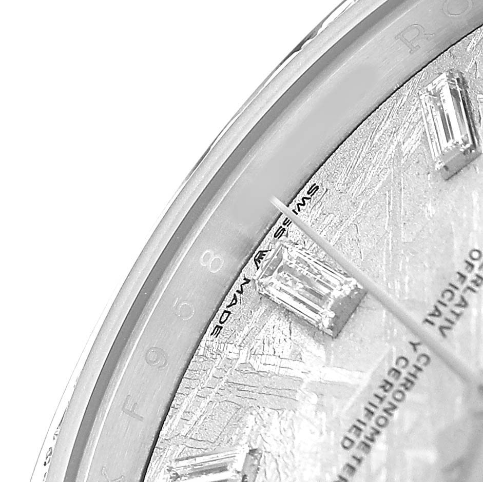 The image shows a close-up of a Rolex President 228349 Men's White Gold Silver Dial watch, focusing on the edge of the dial with diamond markers and detailed engravings.