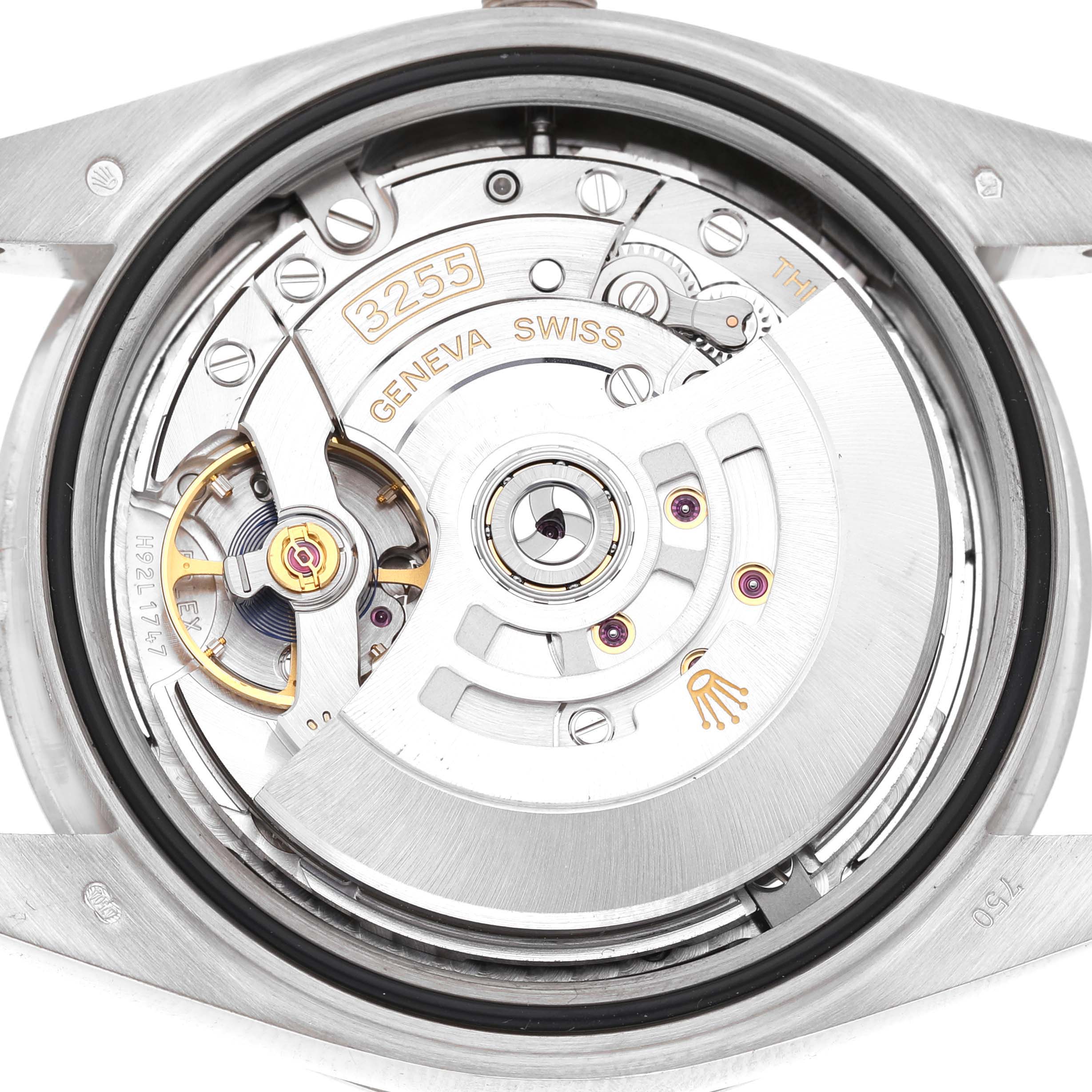 The image shows the movement of a Rolex President 228349 Men's White Gold Silver Dial model from a top-down angle, highlighting the intricate internal components.