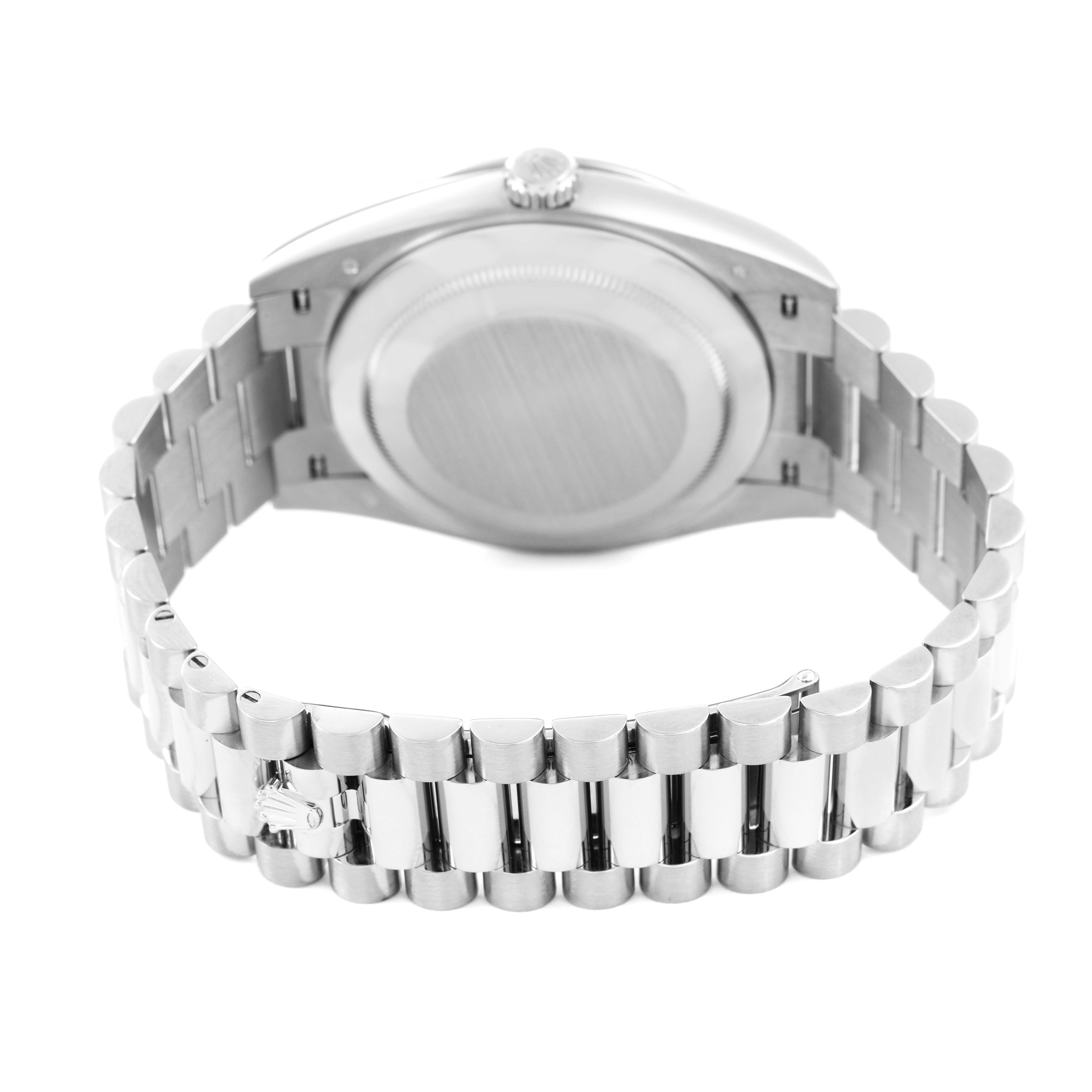 The image shows the rear view of a Rolex President 228349 Men's White Gold Silver Dial model, highlighting the case back and metal bracelet.