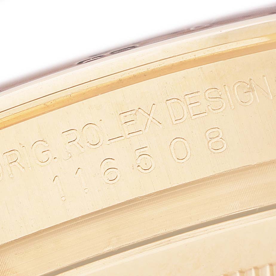 The image shows a close-up of the side of a Rolex Daytona 116508 Men's Yellow Gold Green Dial, highlighting the engraved model and design numbers.