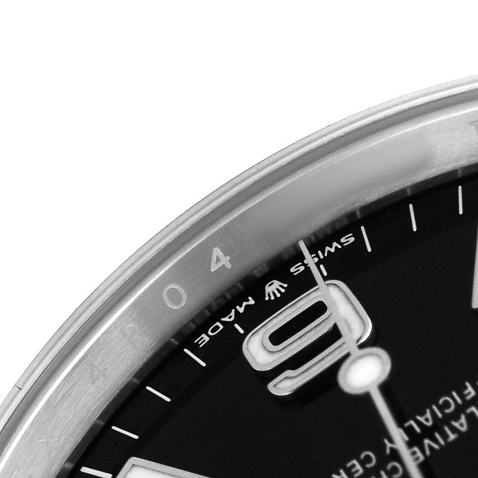 The image shows a partial close-up of the Rolex Explorer 124270 Men's Stainless Steel Black Dial's dial and bezel, highlighting the number "9" and "SWISS MADE" text.