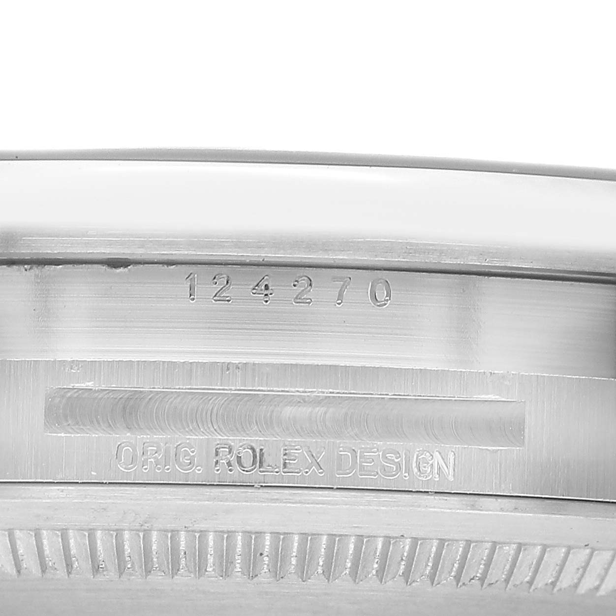 The image shows the side engraving of the case on a Rolex Explorer 124270 Men's Stainless Steel Black Dial, displaying the serial and model numbers.