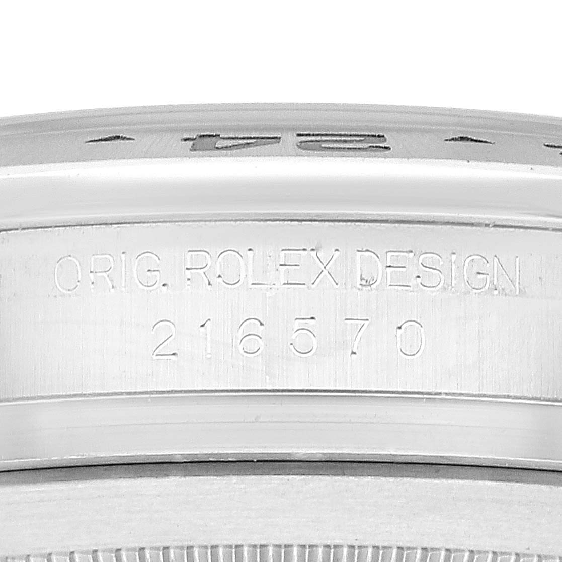 This image shows a close-up of the inner bezel and case serial number of a Rolex Explorer 216570 Men
s Stainless Steel White Dial 216570 Men
s Stainless Steel White Dial watch, model 216570.