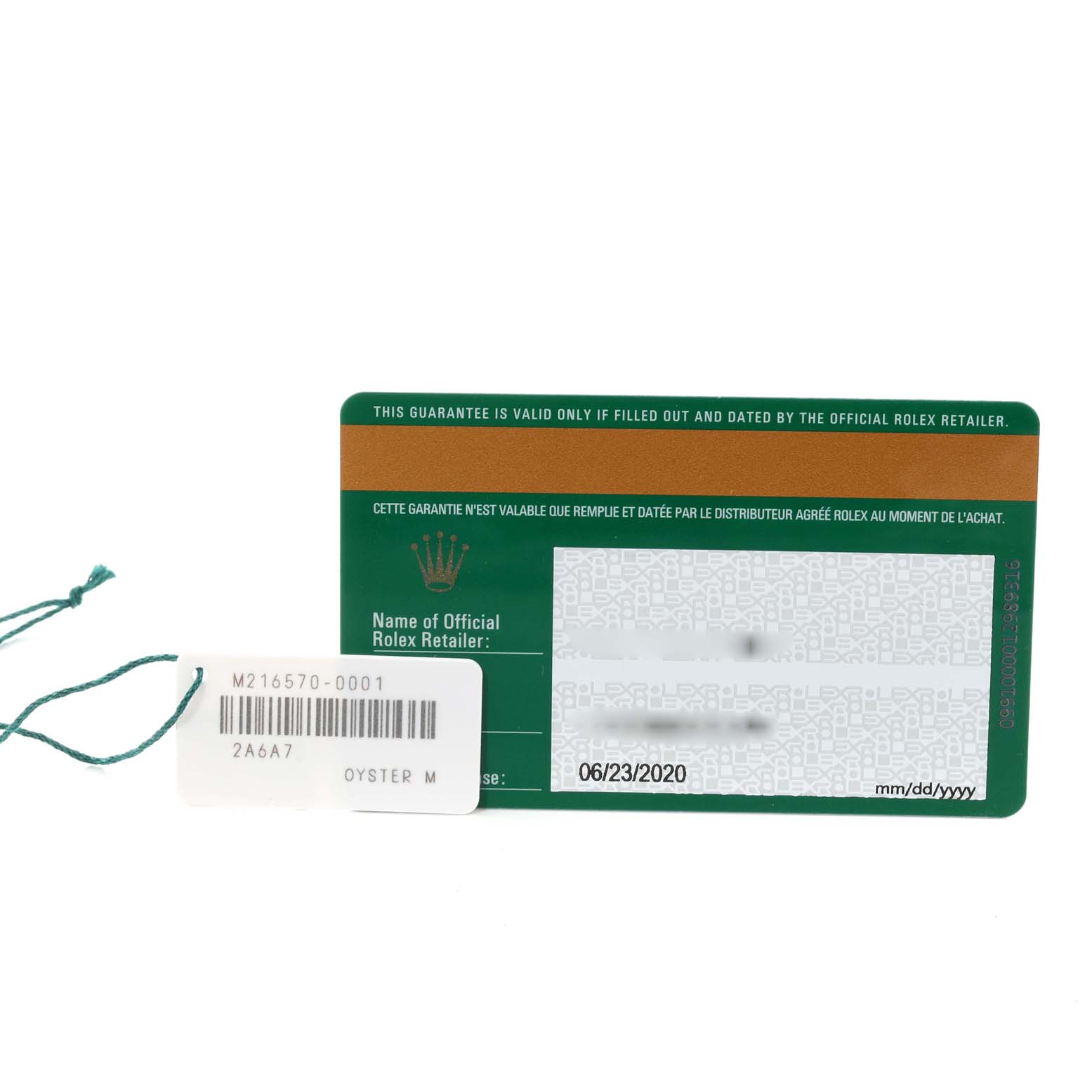 The image shows a Rolex Explorer 216570 Men
s Stainless Steel White Dial 216570 Men
s Stainless Steel White Dial warranty card and tag with model number M216570-0001 and date of purchase.