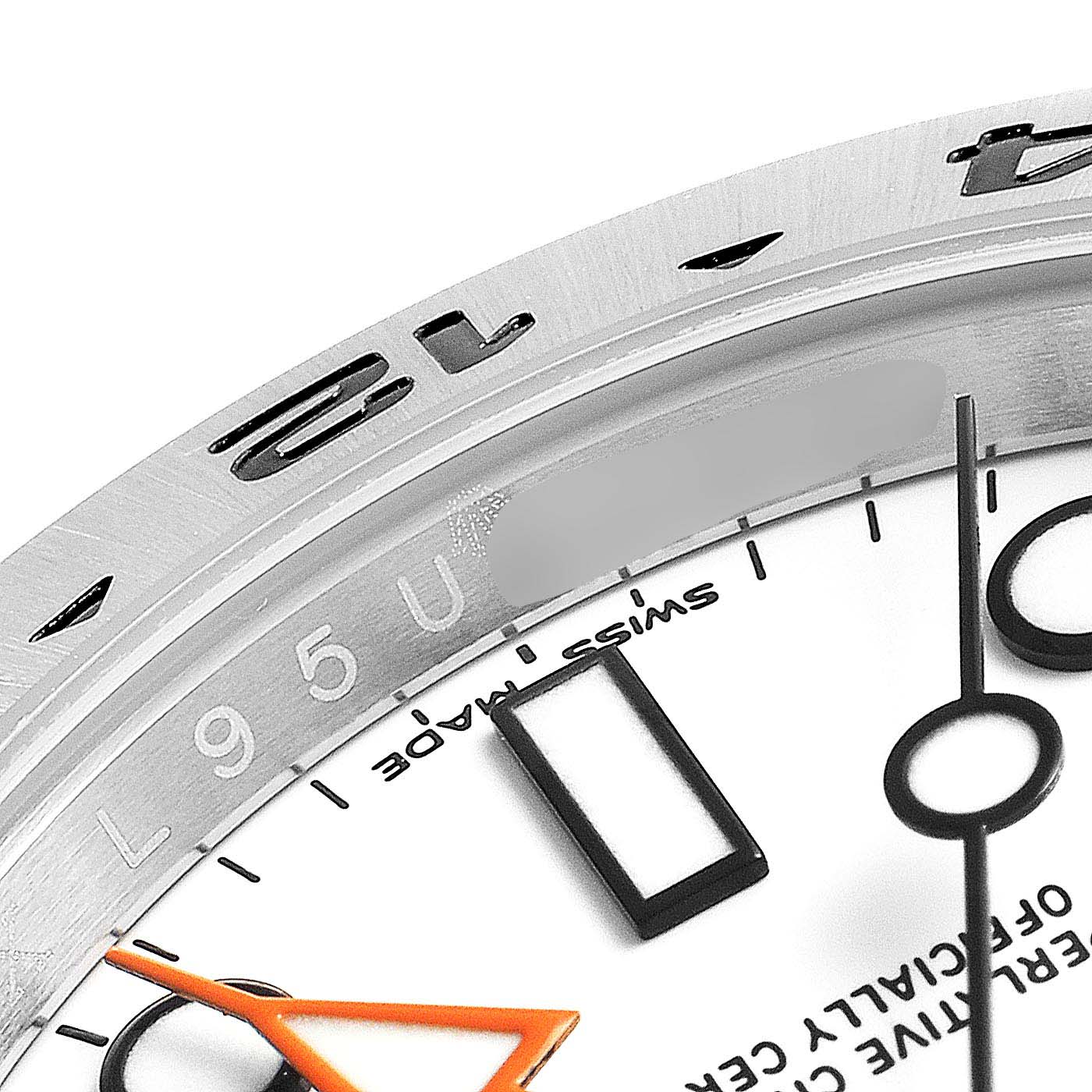This close-up shows the dial and the bezel of a Rolex Explorer 216570 Men
s Stainless Steel White Dial 216570 Men
s Stainless Steel White Dial watch, highlighting the hour markers and hands.