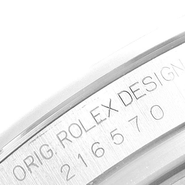 This close-up image shows the engraving on the side of a Rolex Explorer 216570 Men
s Stainless Steel White Dial 216570 Men
s Stainless Steel White Dial watch.