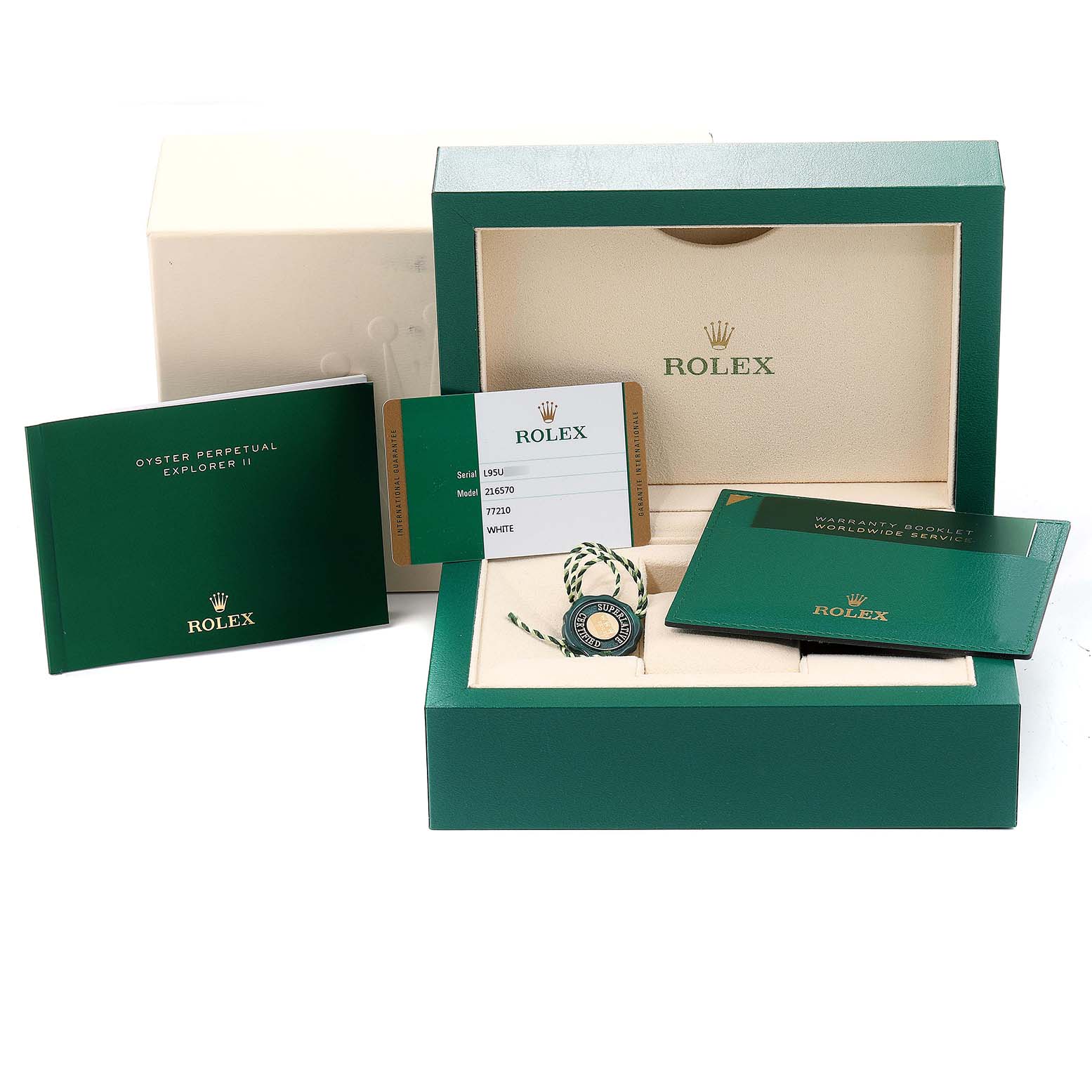 This image shows the packaging and accessories for a Rolex Explorer 216570 Men
s Stainless Steel White Dial 216570 Men
s Stainless Steel White Dial watch, including the box, booklet, warranty card, and hang tag.