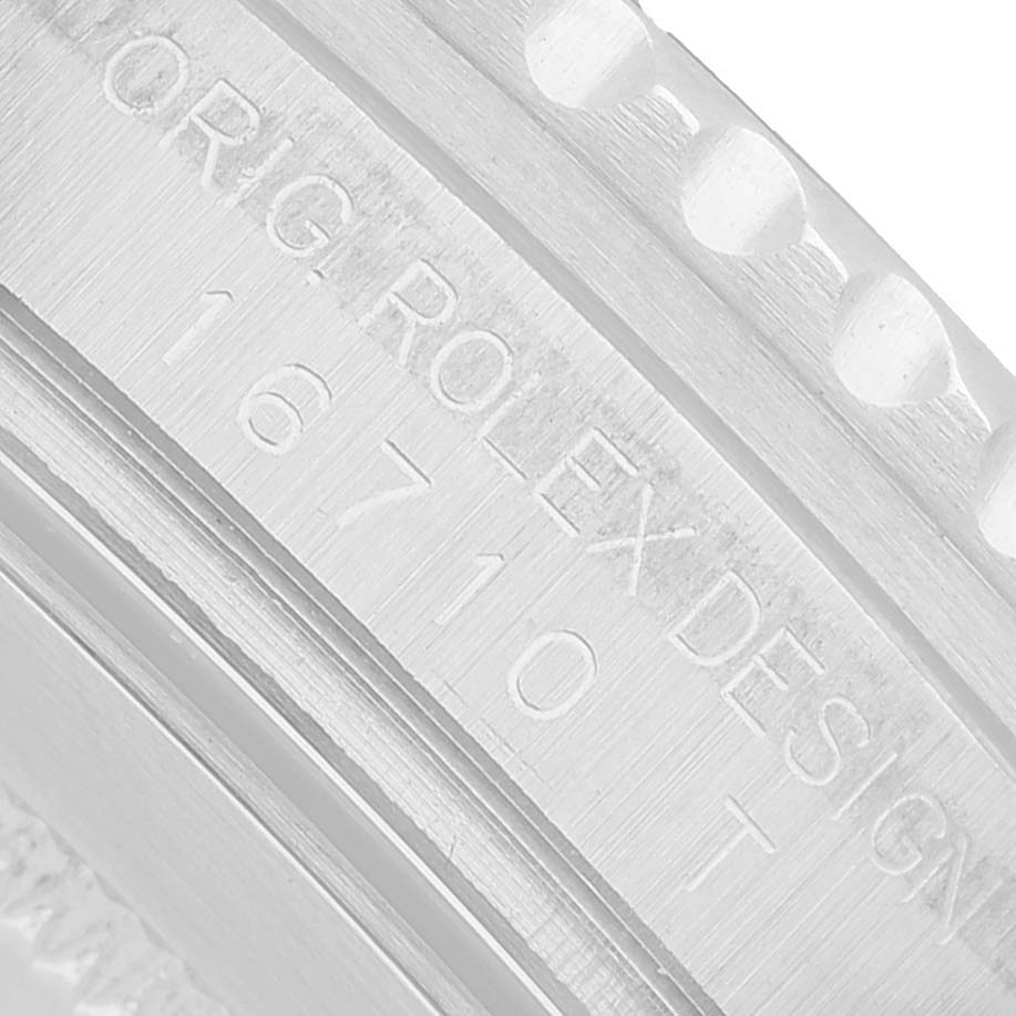 This image shows a close-up of the case side engraving on a Rolex GMT-Master 16710 Men's Stainless Steel Black Dial model, displaying the model number and branding.