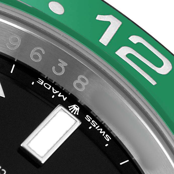 The image shows a close-up of the bezel and part of the dial on a Rolex GMT-Master 126720VTNR Men's Stainless Steel Black Dial watch, highlighting the 24-hour markers.