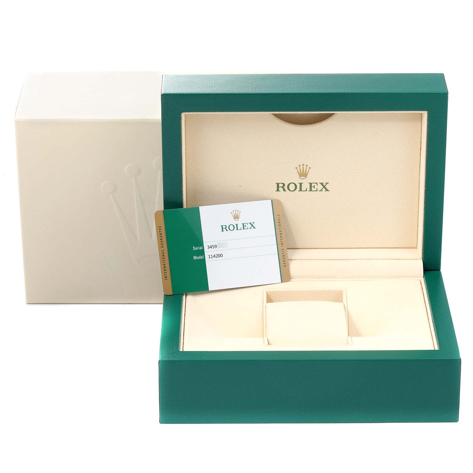 The image shows the packaging box and warranty card for the Rolex Oyster Perpetual 114200 Men's Stainless Steel Green Dial 114200 Men's Stainless Steel Green Dial watch model.