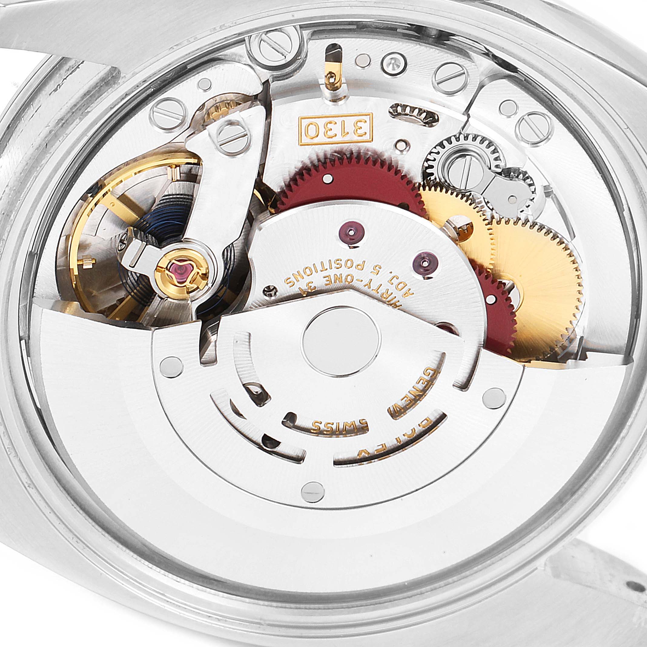 This is a close-up view of the movement mechanism of a Rolex Oyster Perpetual 114200 Men's Stainless Steel Green Dial 114200 Men's Stainless Steel Green Dial watch, showing internal gears and components.