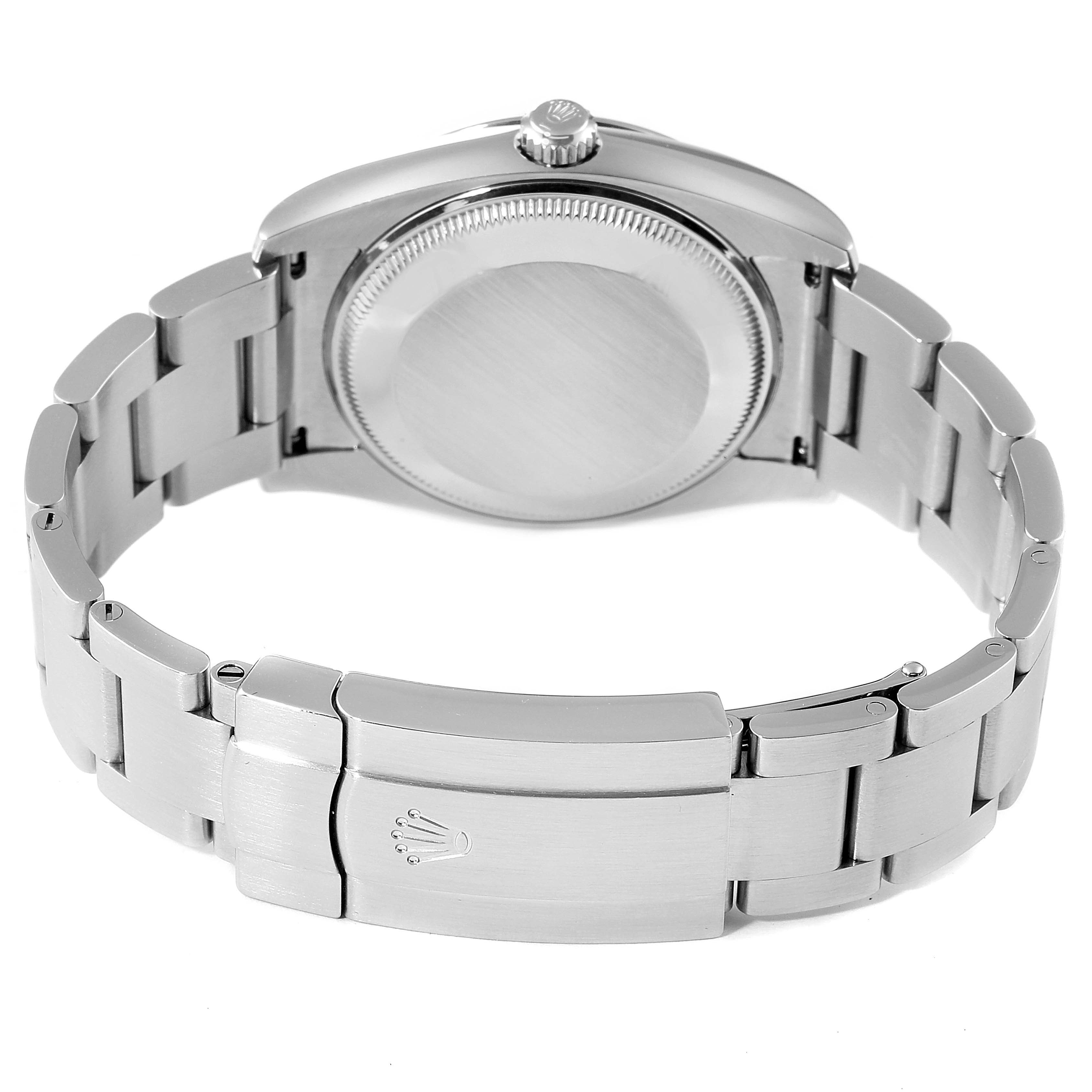 The image shows the back view of the Rolex Oyster Perpetual 114200 Men's Stainless Steel Green Dial 114200 Men's Stainless Steel Green Dial watch, focusing on the clasp, bracelet, and case back.