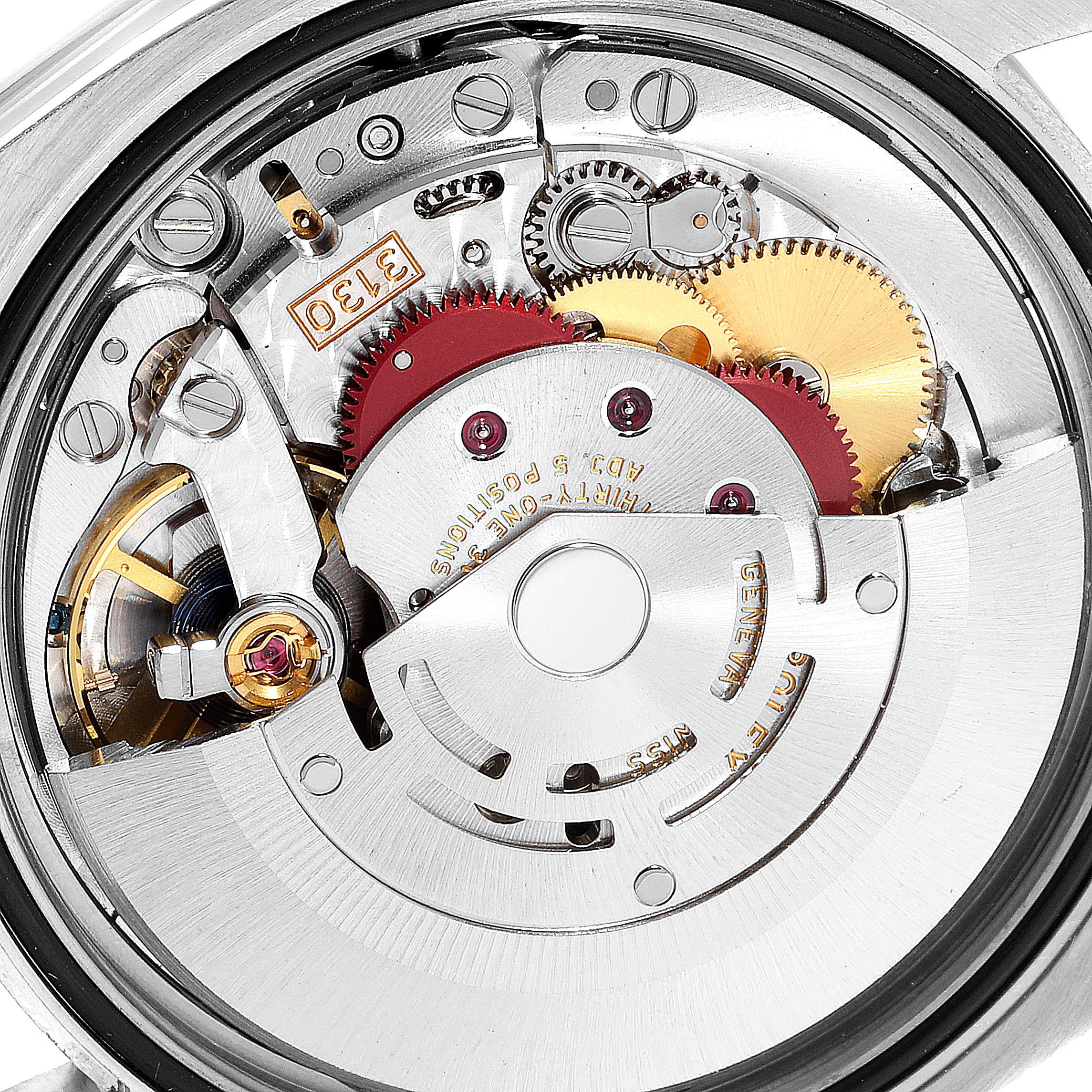 This is a close-up shot of the movement mechanism inside a Rolex Oyster Perpetual 116000 Men's Stainless Steel Blue Dial 116000 Men's Stainless Steel Blue Dial watch.