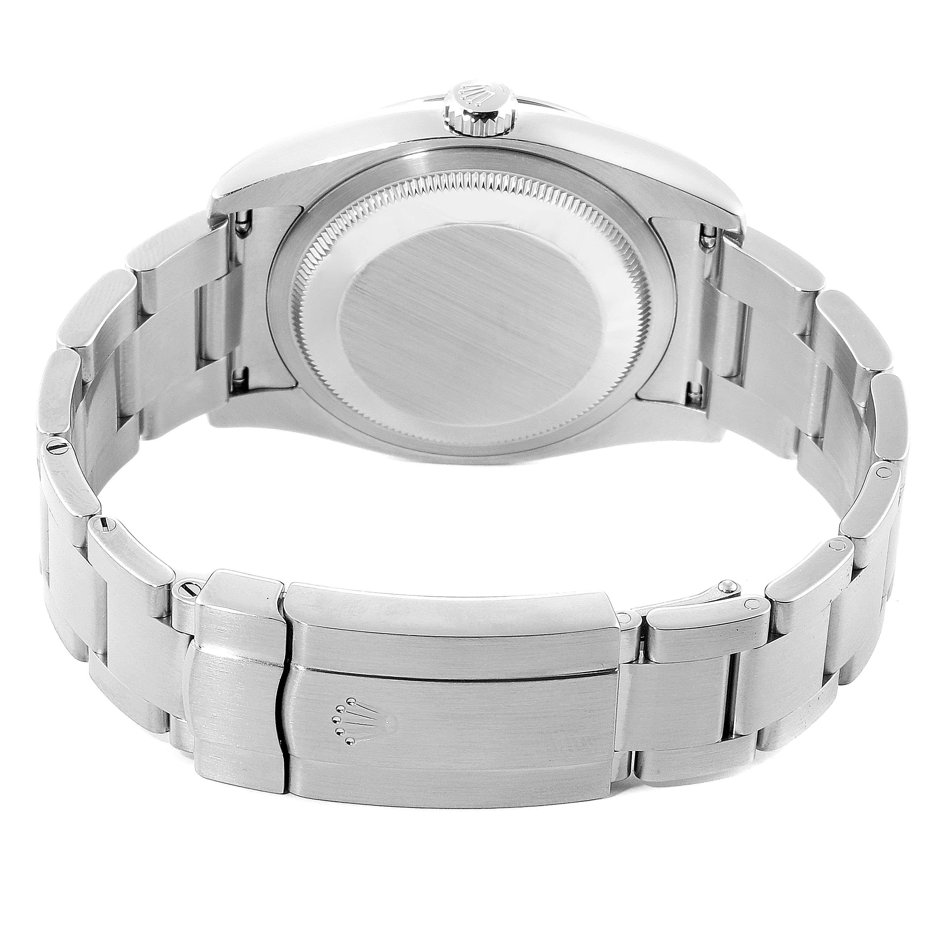 This image shows the back casing and bracelet clasp of a Rolex Oyster Perpetual 116000 Men's Stainless Steel Blue Dial 116000 Men's Stainless Steel Blue Dial watch.