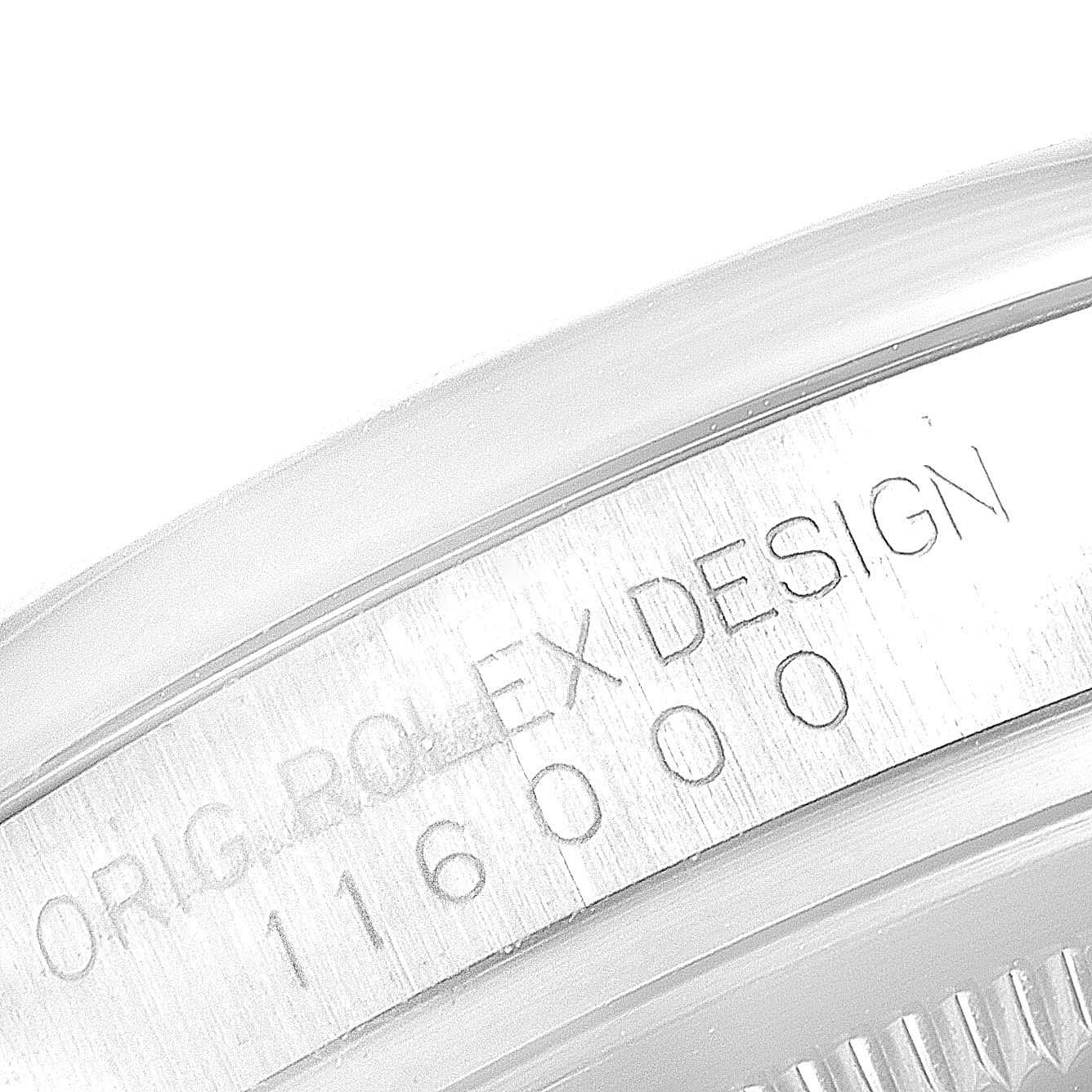 The image shows a close-up of the inner bezel of a Rolex Oyster Perpetual 116000 Men's Stainless Steel Blue Dial 116000 Men's Stainless Steel Blue Dial watch, displaying its model number and "ORIG ROLEX DESIGN" text.