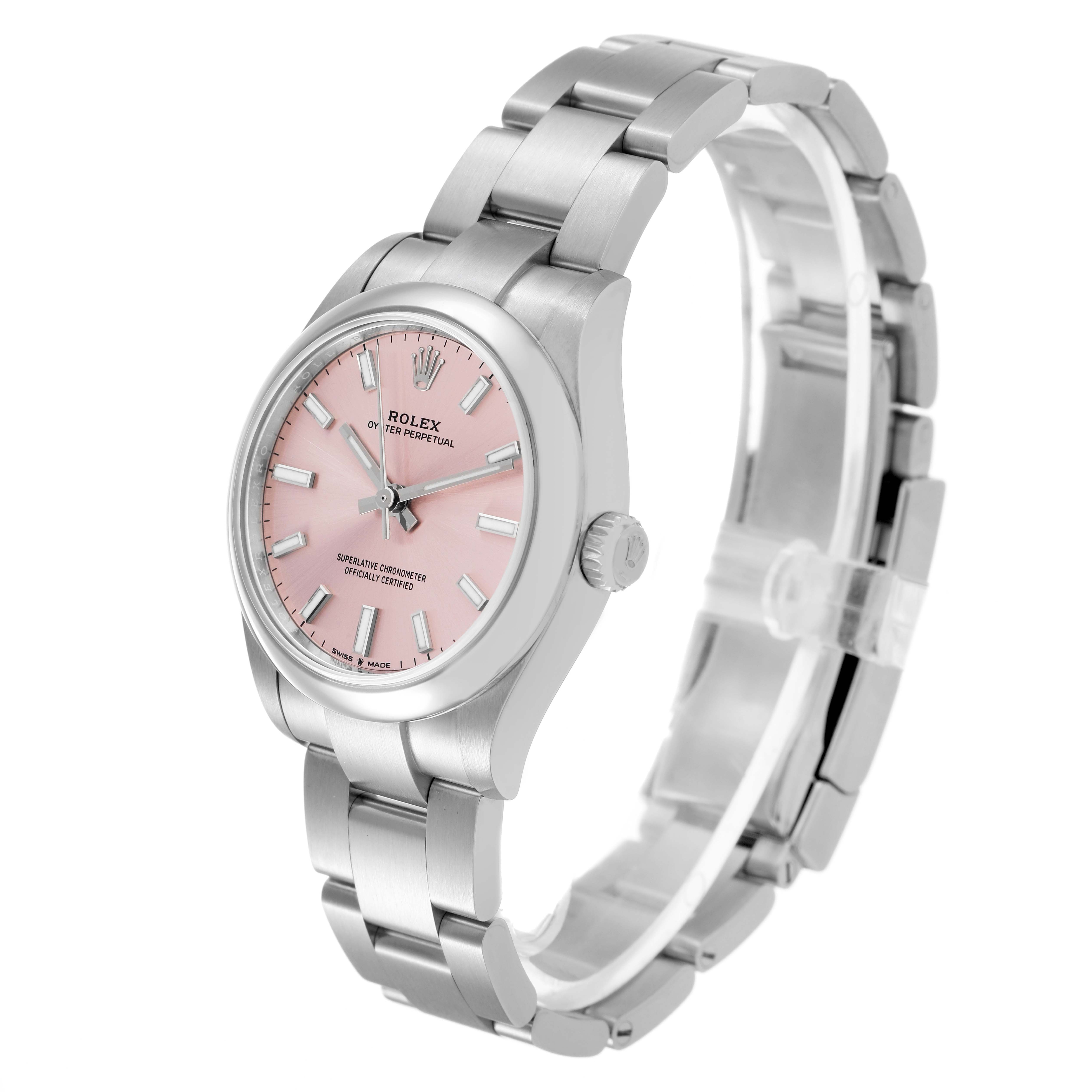 The Rolex Oyster Perpetual Women's Stainless Steel Pink Dial is angled to show the pink dial, case, bezel, crown, and part of the bracelet.