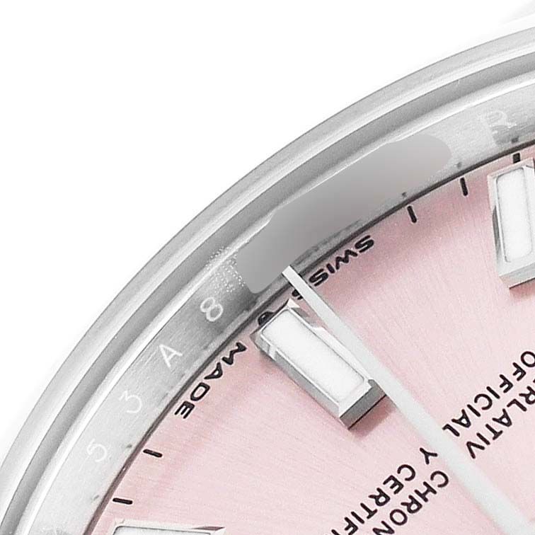 The image shows a close-up of the Rolex Oyster Perpetual Women's Stainless Steel Pink Dial watch face from an angled top view, highlighting the dial and markers.