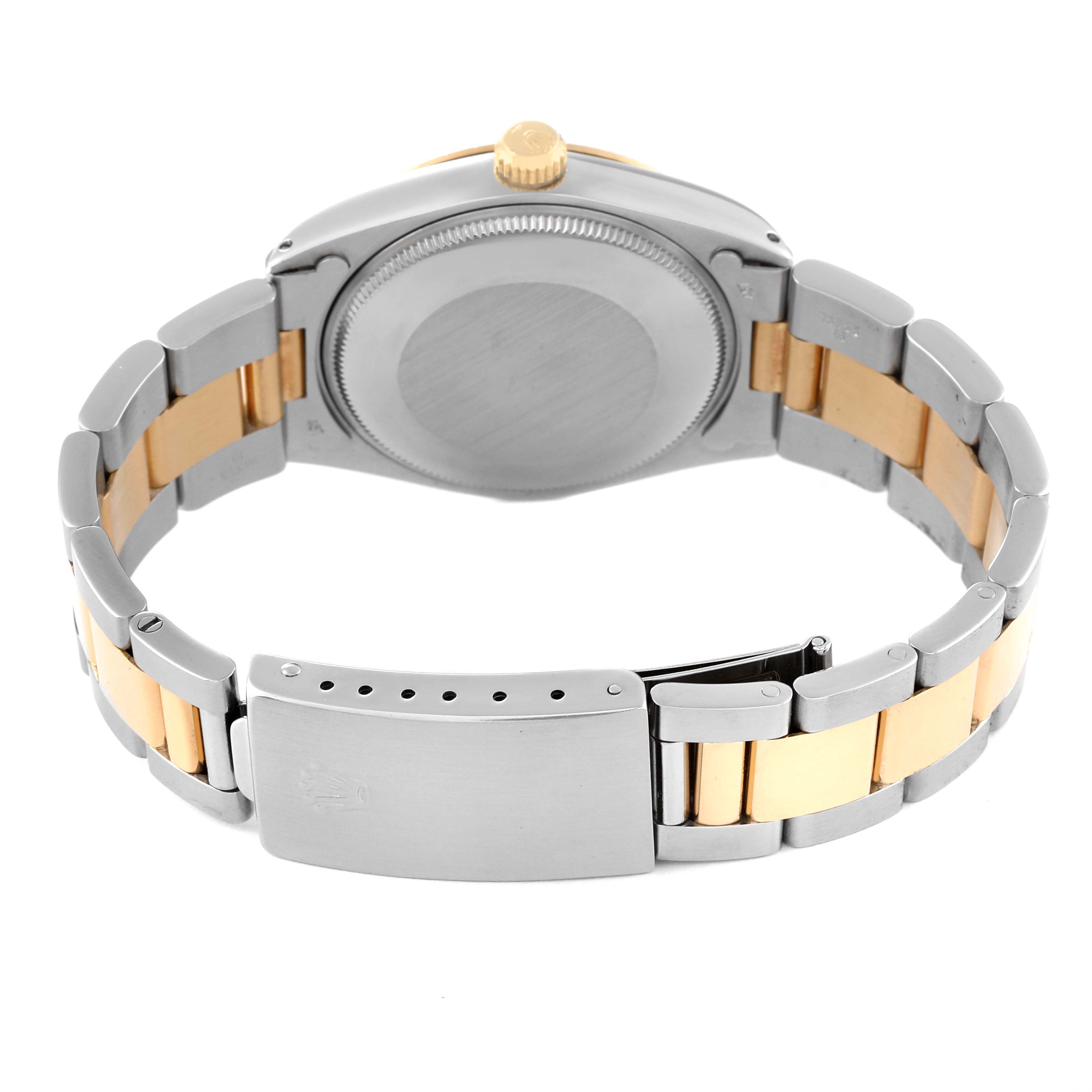 The image shows the back case, crown, and bracelet clasp of a Rolex Oyster Perpetual 1005 Men's Steel and Gold (two tone) Champagne Dial 1005 Men's Steel and Gold (two tone) Champagne Dial watch.
