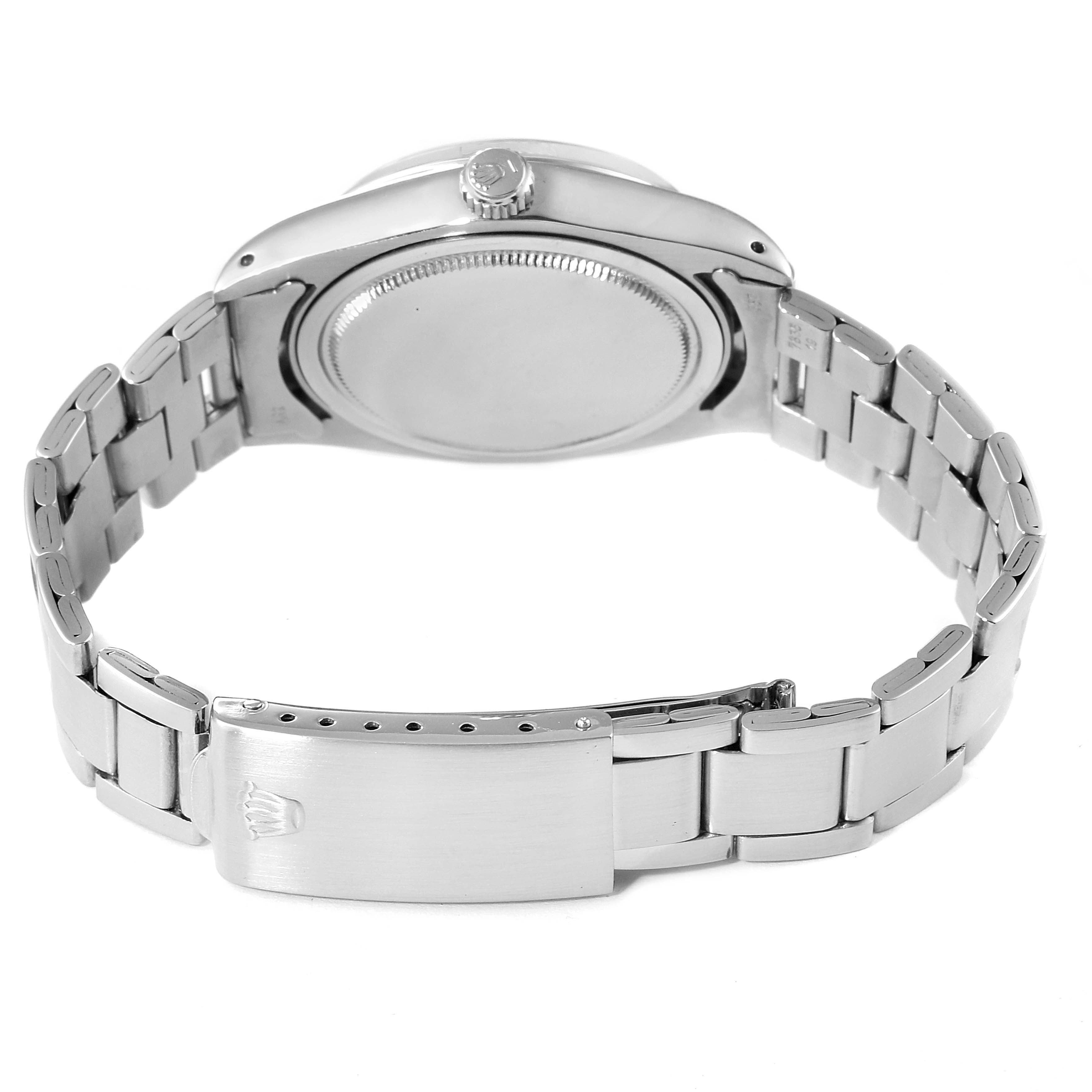 Shown from the back, this Rolex Vintage Collection 6694 Men's Stainless Steel Blue Dial 6694 Men's Stainless Steel Blue Dial watch highlights the case back, crown, and metal bracelet with clasp.