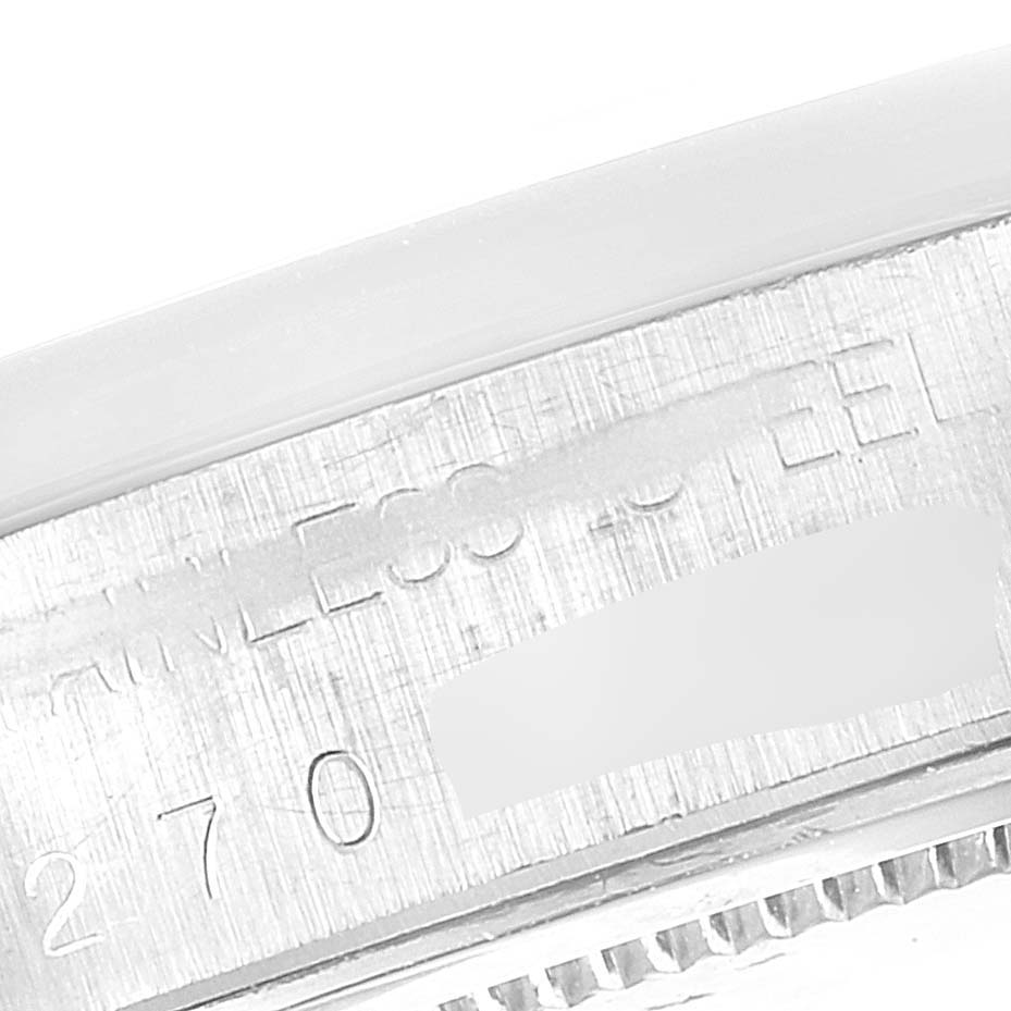 The image shows a close-up view of the watch case with "Stainless Steel" text and partial serial number on the Rolex Vintage Collection 6694 Men's Stainless Steel Blue Dial 6694 Men's Stainless Steel Blue Dial model.