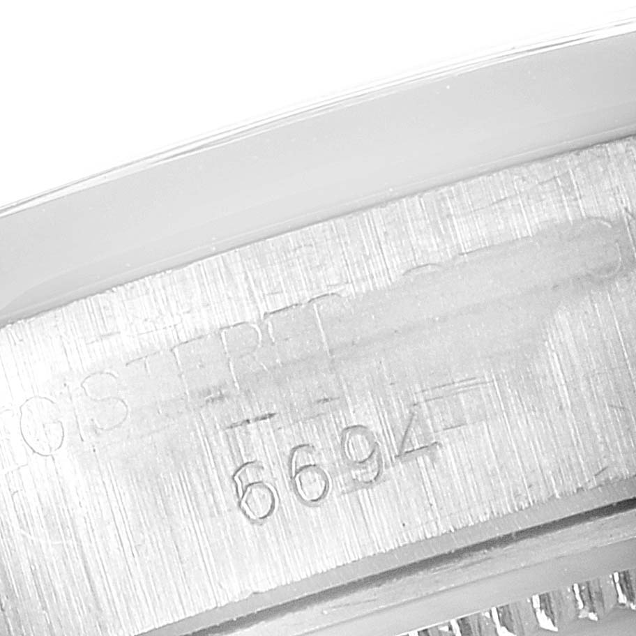 This image shows a close-up view of the serial number engraved on the case back of the Rolex Vintage Collection 6694 Men's Stainless Steel Blue Dial 6694 Men's Stainless Steel Blue Dial model.