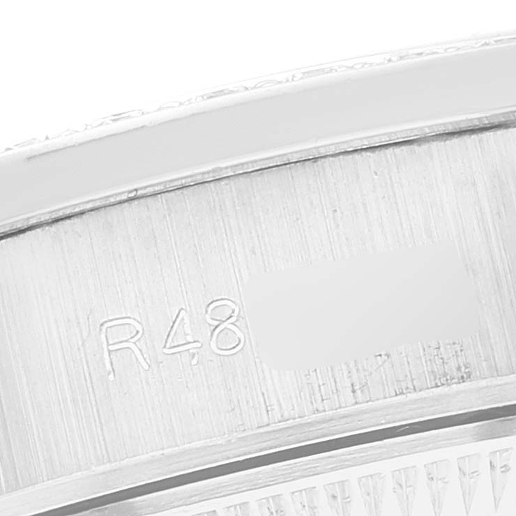This image shows a close-up of the inner bezel with engravings on a Rolex President 69139 Women's White Gold Silver Dial 69139 Women's White Gold Silver Dial model watch.
