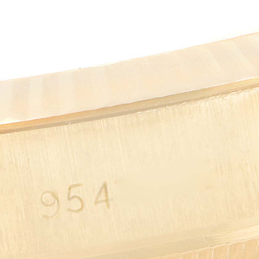 This image shows a close-up angle of the bezel and part of the case, featuring the model number engraving on a Rolex President 69178 Women
s Yellow Gold Champagne Dial 69178 Women
s Yellow Gold Champagne Dial watch.