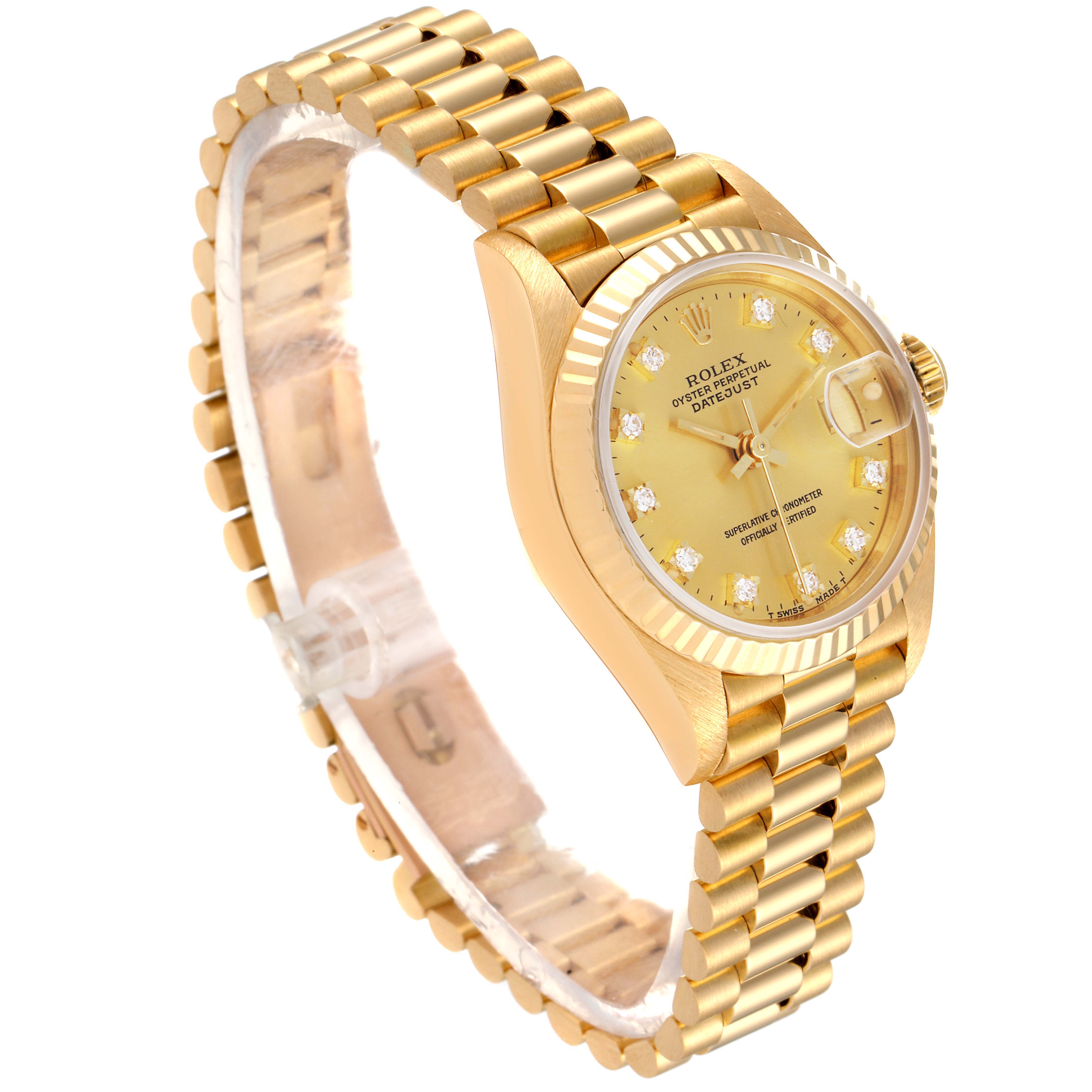 The image shows a Rolex President 69178 Women
s Yellow Gold Champagne Dial 69178 Women
s Yellow Gold Champagne Dial model watch at an oblique angle, highlighting its gold bracelet, case, and diamond hour markers.