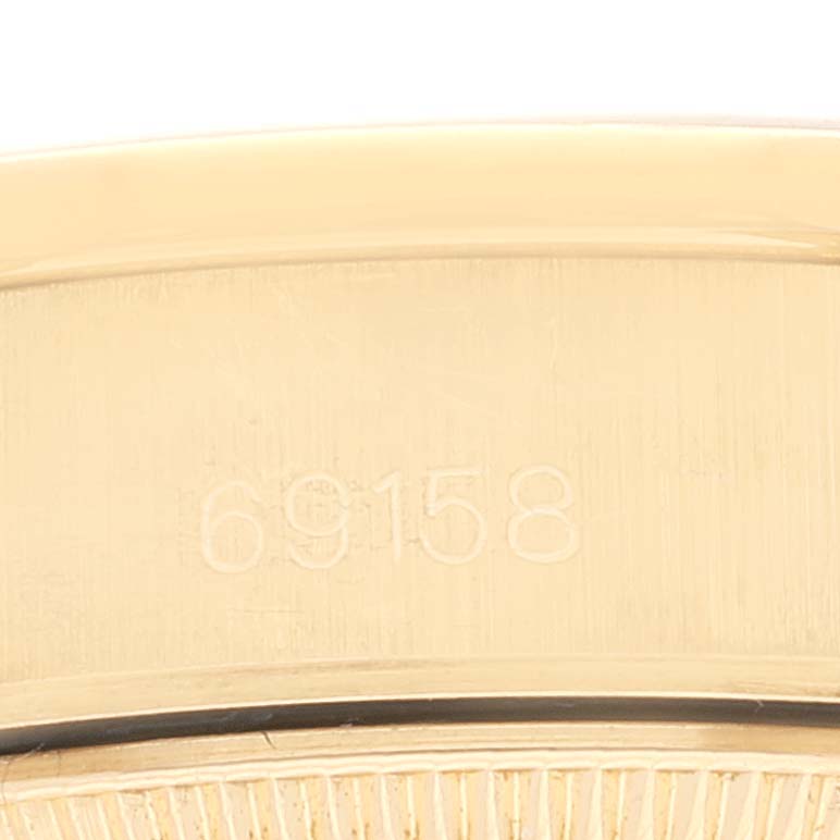 The image shows a close-up of the case back engraving "69158" of the Rolex President 69158 Women
s Yellow Gold Champagne Dial 69158 Women
s Yellow Gold Champagne Dial model watch.
