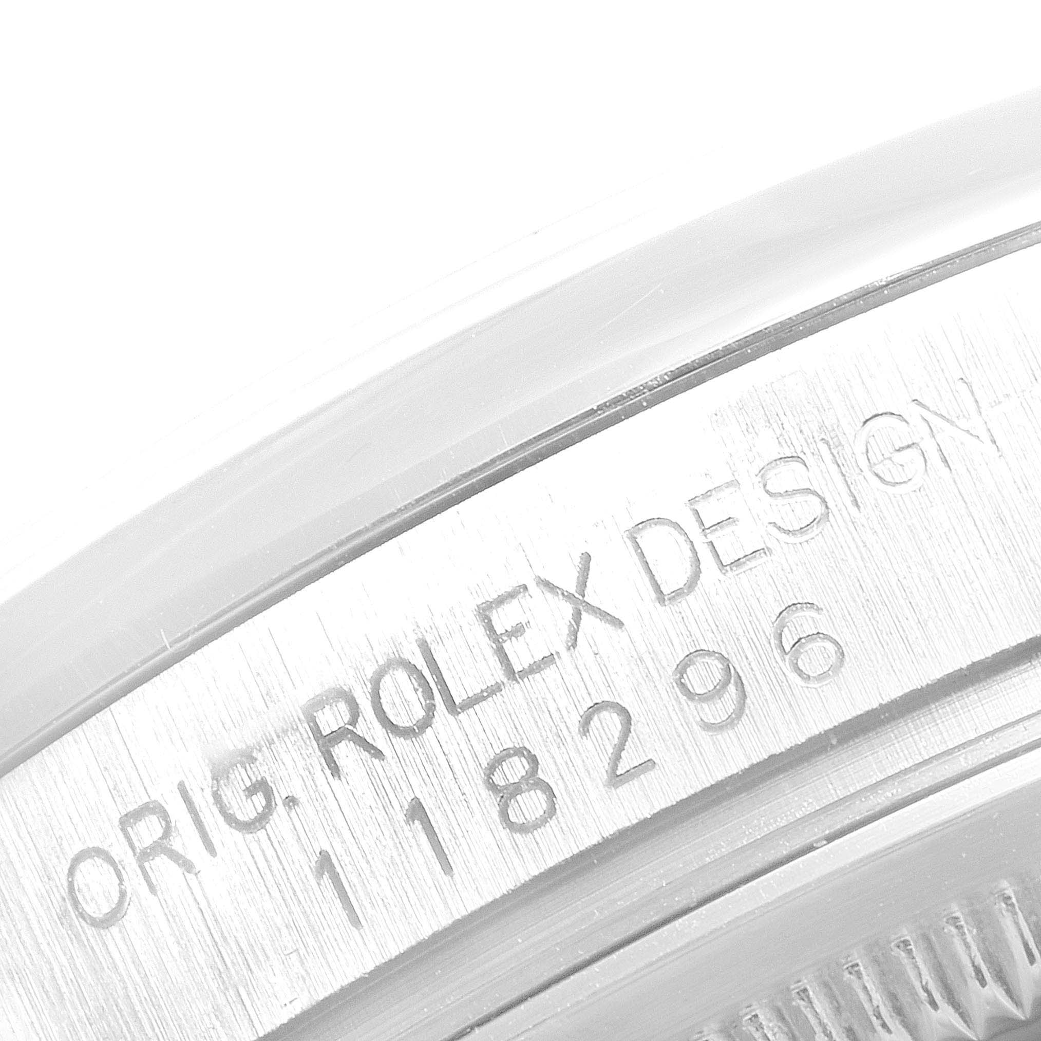 The image shows a close-up view of the engraved case back of the Rolex President 118296 Men's Platinum Blue Dial 118296 Men's Platinum Blue Dial model watch.