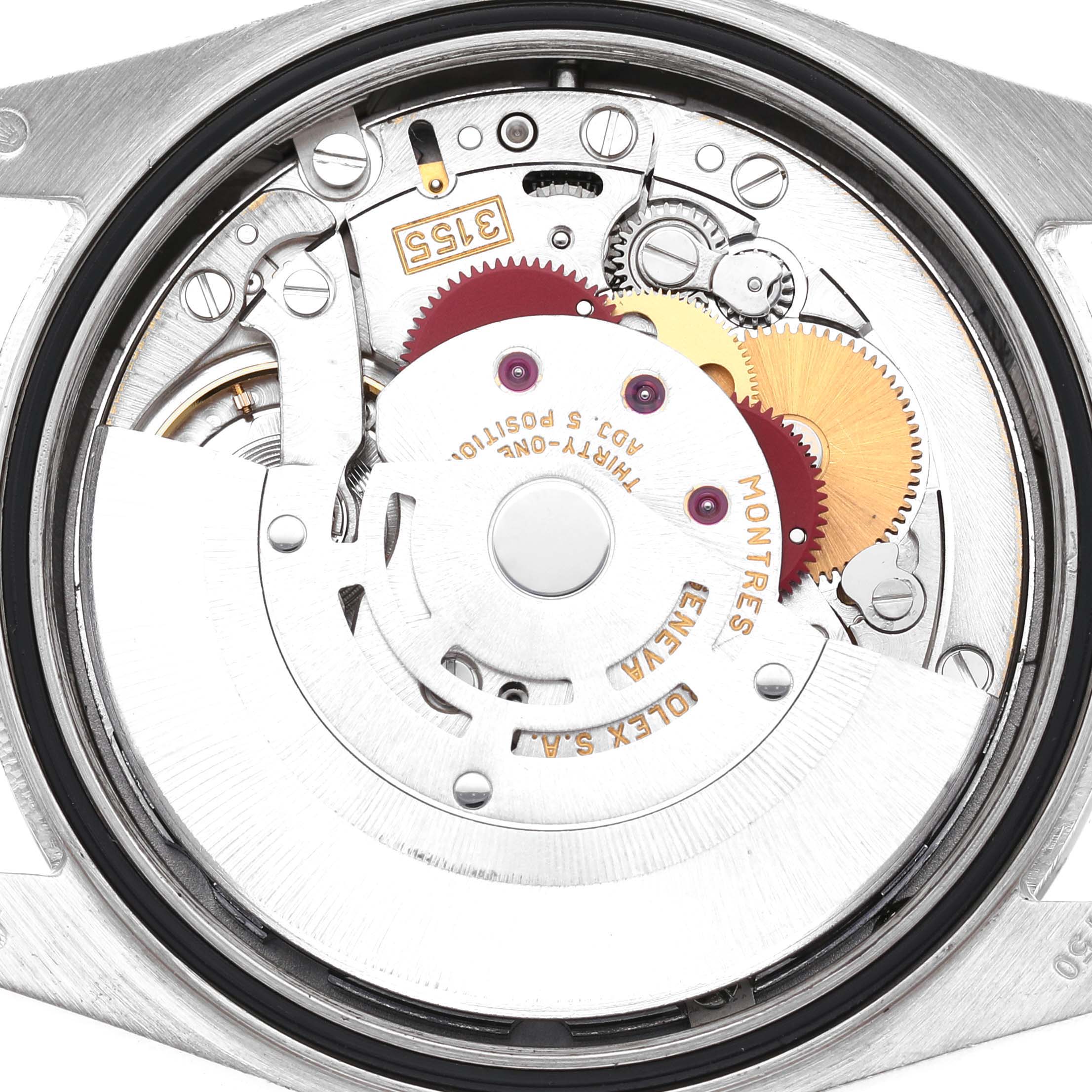 The image shows a close-up of the movement inside a Rolex President 118239 Men's White Gold Silver Dial watch, revealing gears and intricate mechanical parts.