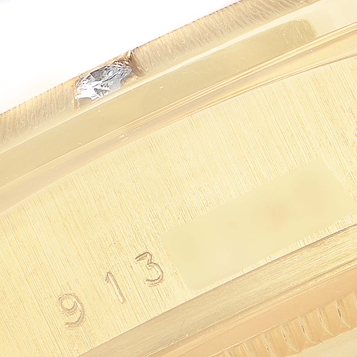 This image shows a close-up of the serial number on the case of a Rolex President 18108 Men
s Yellow Gold Champagne Dial 18108 Men
s Yellow Gold Champagne Dial watch.
