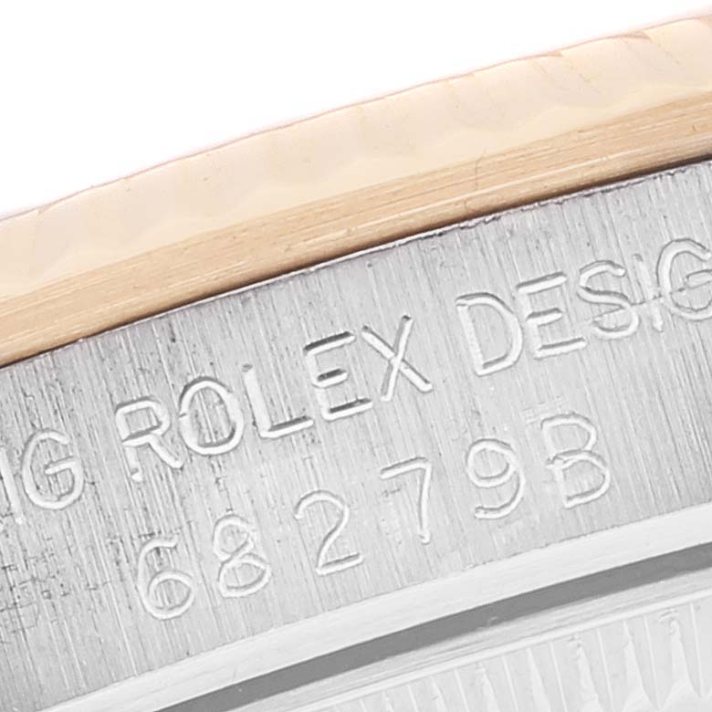 The image shows a close-up of the engraving on the case back of a Rolex President 68279 Women
s Steel and Gold (two tone) Champagne Dial 68279 Women
s Steel and Gold (two tone) Champagne Dial model watch.