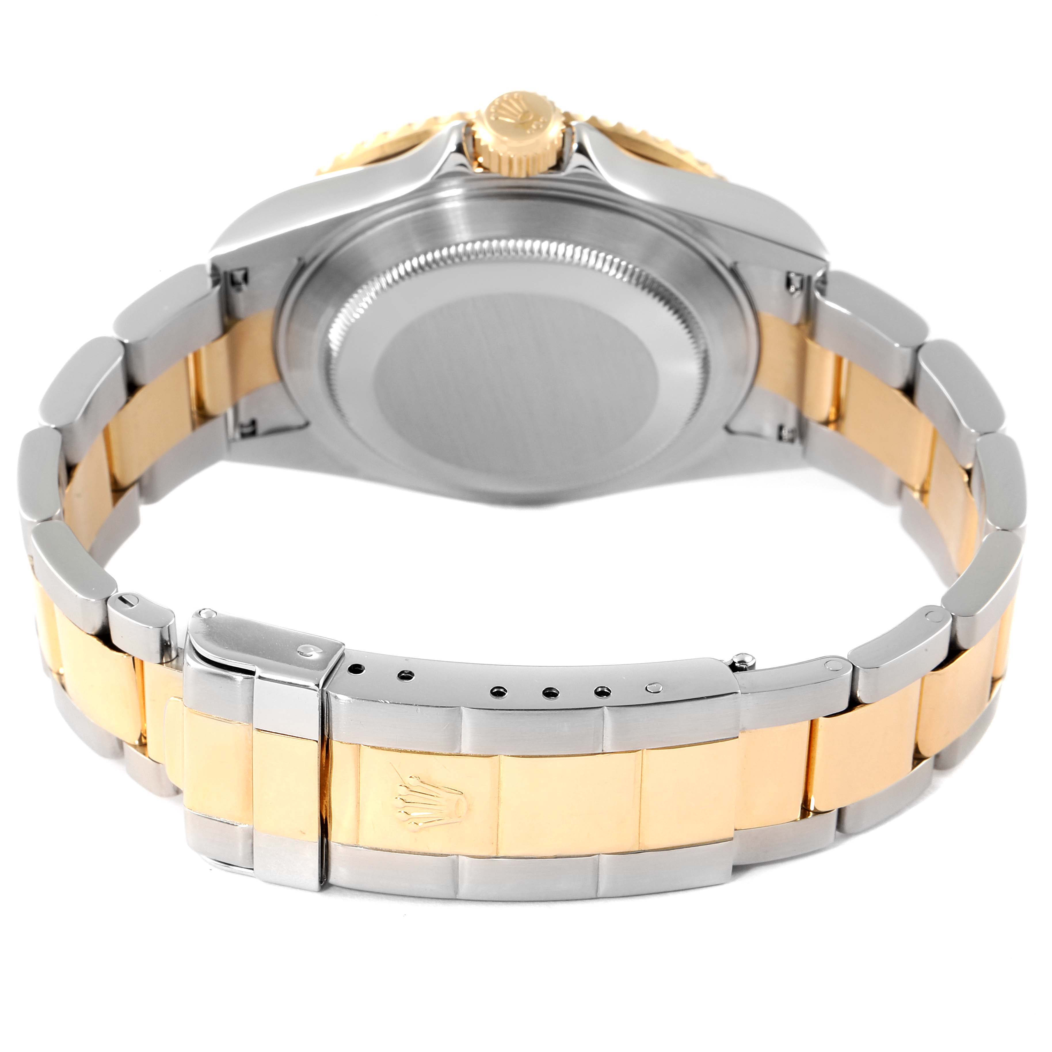 This image shows the back view of a Rolex Submariner 16613 Men
s Steel and Gold (two tone) Blue Dial 16613 Men
s Steel and Gold (two tone) Blue Dial, highlighting its case, crown, and two-tone bracelet.