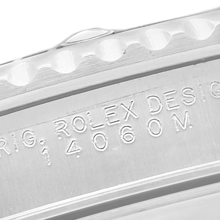 The image shows a close-up angle of the case side of the Rolex Submariner 14060M Men
s Stainless Steel Black Dial 14060M Men
s Stainless Steel Black Dial watch, focusing on the engraved model number.