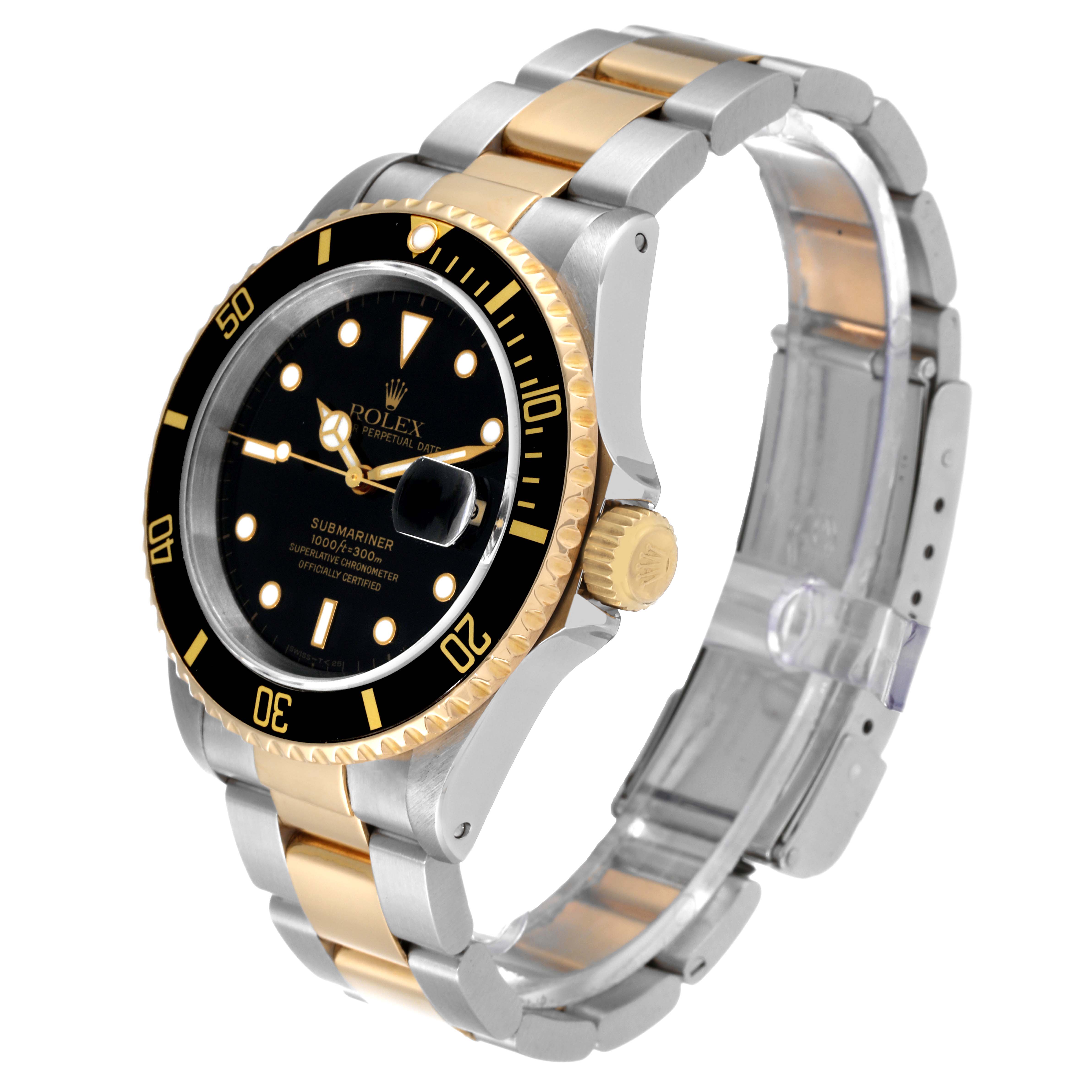 The Rolex Submariner 16613 Men
s Steel and Gold (two tone) Black Dial 16613 Men
s Steel and Gold (two tone) Black Dial watch is shown at a three-quarter angle, highlighting its black dial, two-tone bracelet, and gold-trimmed bezel.