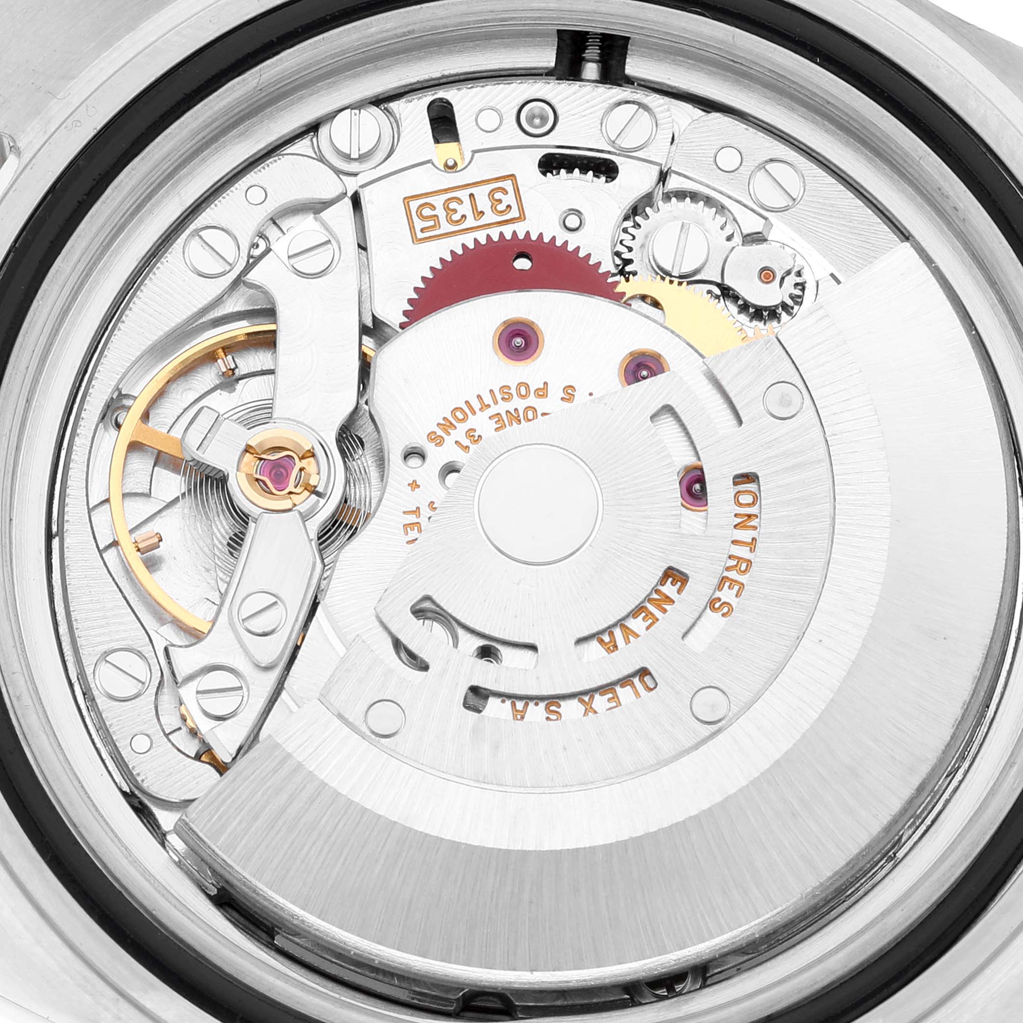 The image shows a close-up view of the movement mechanism inside a Rolex Submariner 16613 Men
s Steel and Gold (two tone) Black Dial 16613 Men
s Steel and Gold (two tone) Black Dial watch.