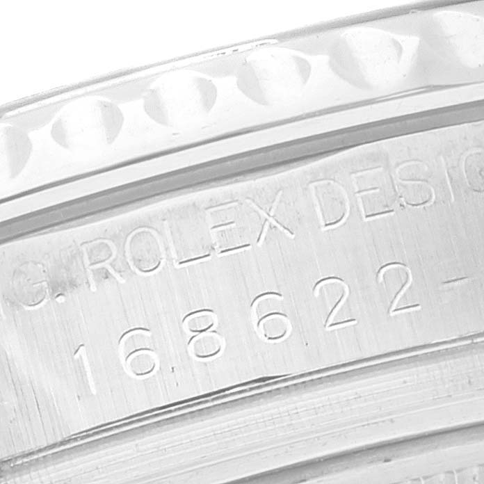 The image shows a close-up of the serial number and "ROLEX DESIGN" engraving on the case of a Rolex Yacht-Master 168622 Men's Stainless Steel Silver Dial 168622 Men's Stainless Steel Silver Dial watch.