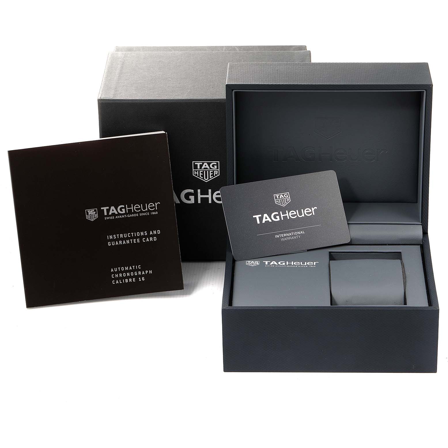 The image shows the Tag Heuer Carrera CBK2112.BA0715 Men
s Stainless Steel Blue Dial CBK2112.BA0715 Men
s Stainless Steel Blue Dial watch packaging, including warranty cards, instruction booklets, and the watch box.