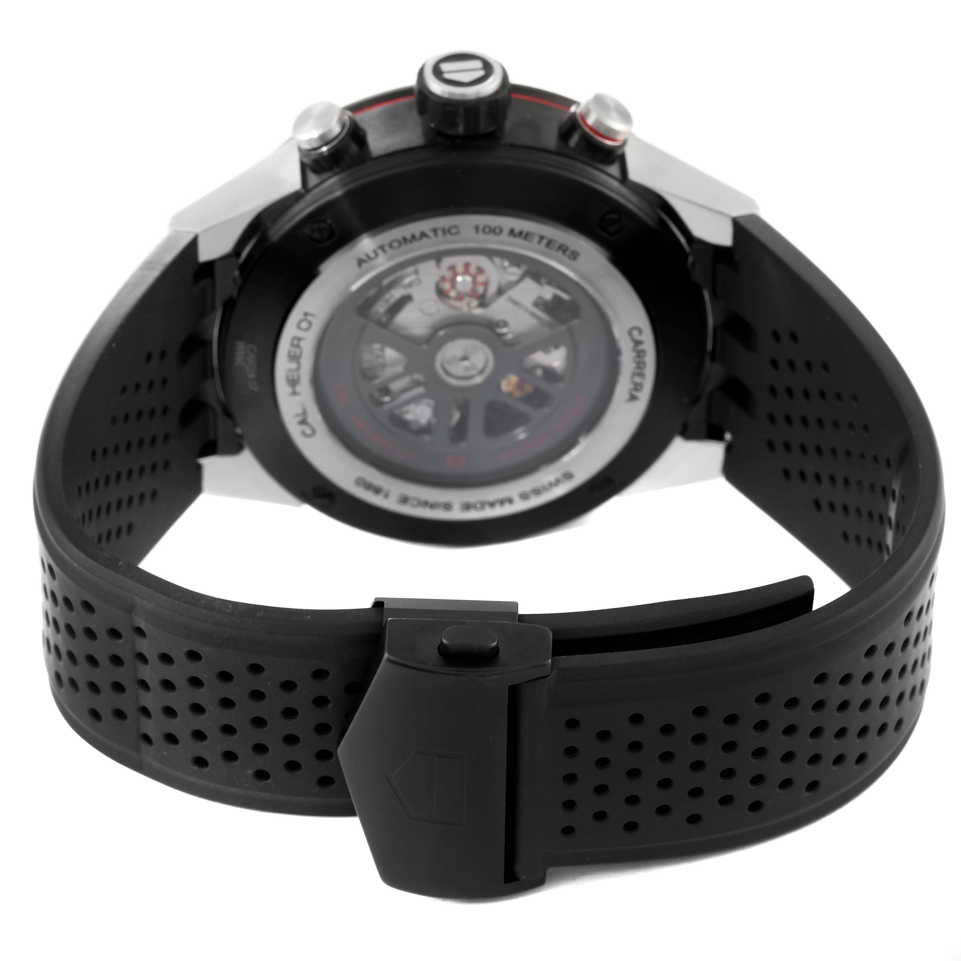 The image shows the back view of the Tag Heuer Carrera CAR2A1Z Men's Stainless Steel Transparent Dial CAR2A1Z Men's Stainless Steel Transparent Dial watch, highlighting its rotor and rubber strap with a clasp.