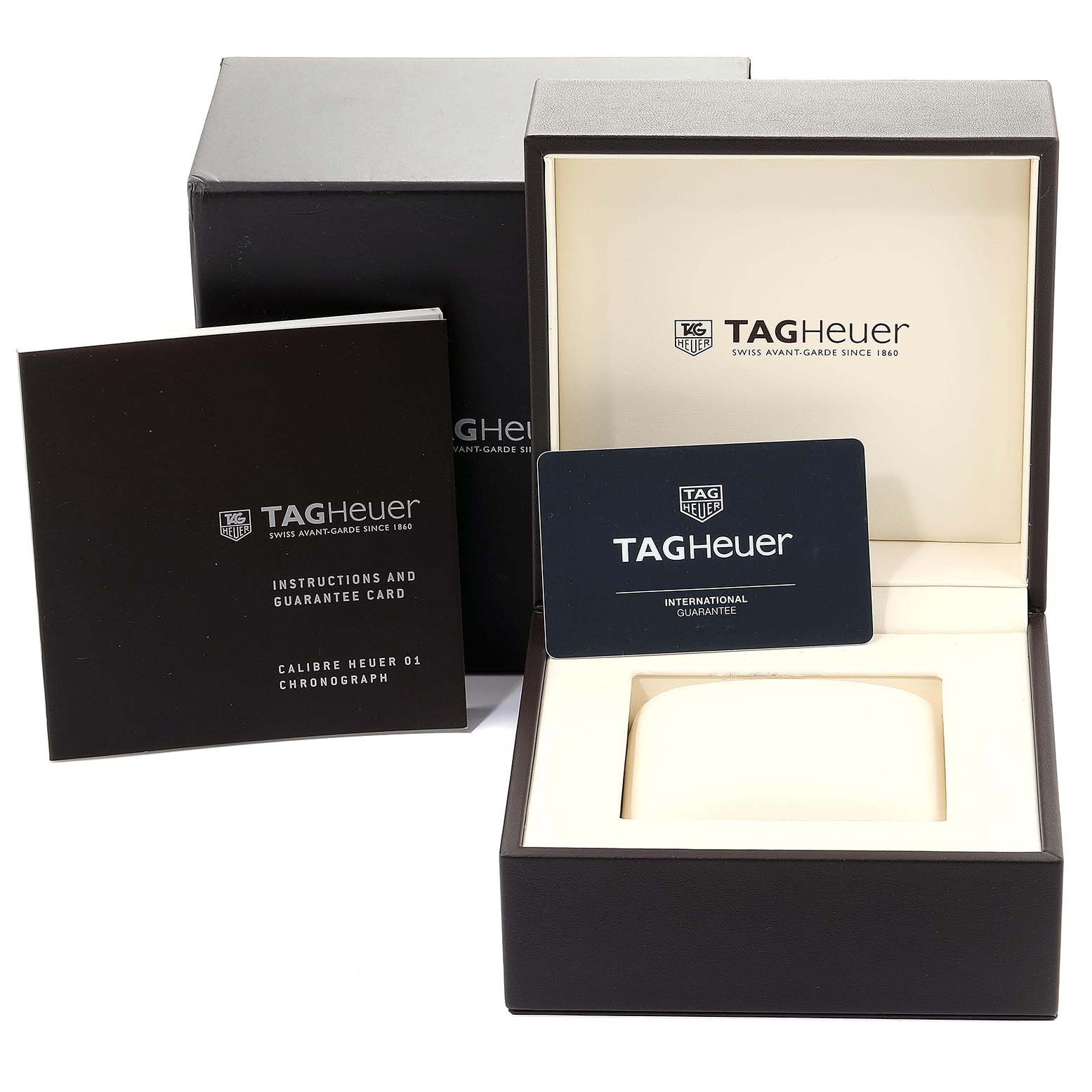 The image shows a Tag Heuer Carrera CAR2A1N.FT6100 Men
s Stainless Steel Blue Dial CAR2A1N.FT6100 Men
s Stainless Steel Blue Dial watch box, guarantee card, and instruction manual.