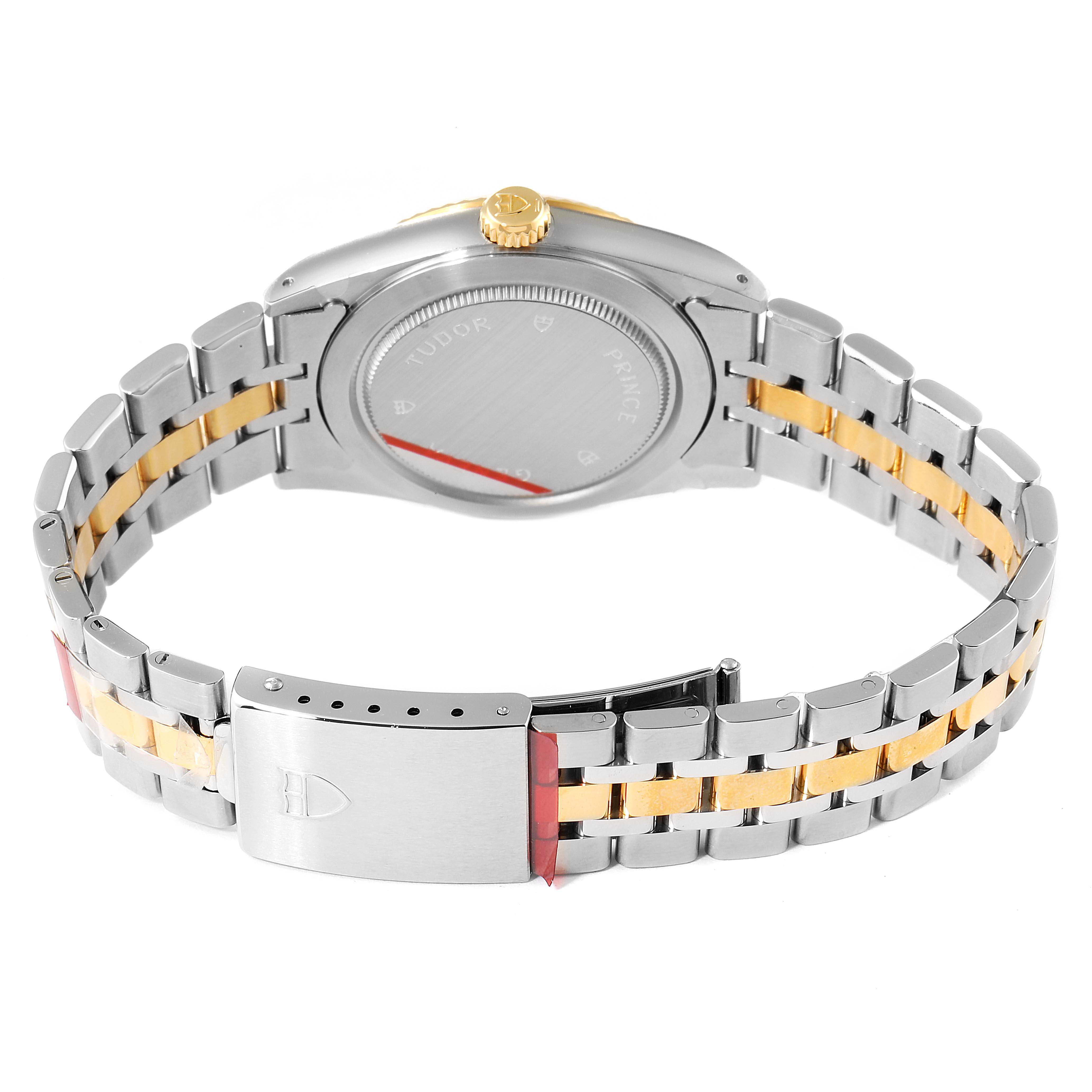 The image shows the back of a Tudor Prince 76213 Men's Steel and Gold (two tone) Silver Dial 76213 Men's Steel and Gold (two tone) Silver Dial watch, featuring its case back, crown, and a two-tone metal bracelet with a clasp.