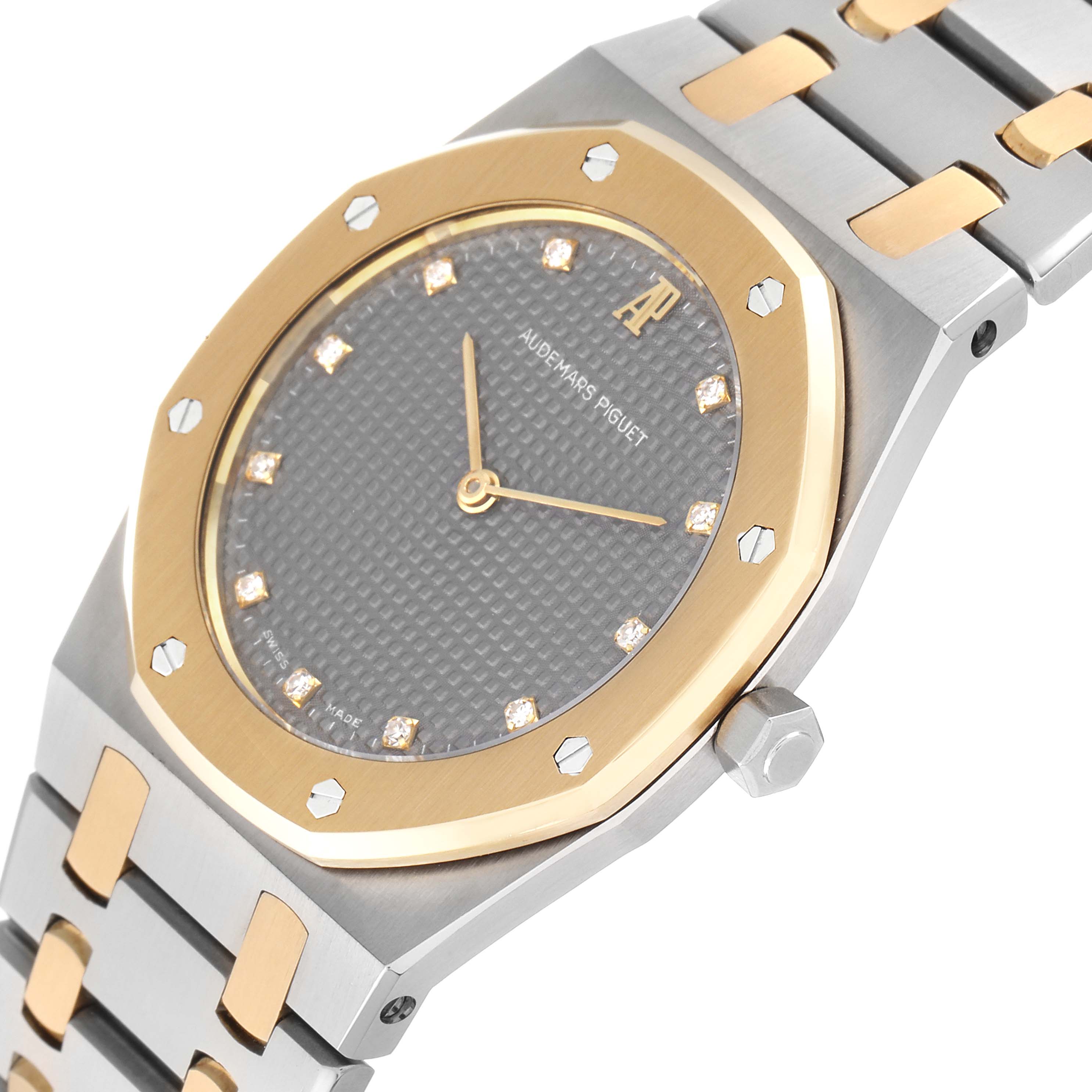 The image shows a close-up angle of the face and partial bracelet of the Audemars Piguet Royal Oak 56303SA Men's Steel and Gold (two tone) Grey Dial 56303SA Men's Steel and Gold (two tone) Grey Dial watch.