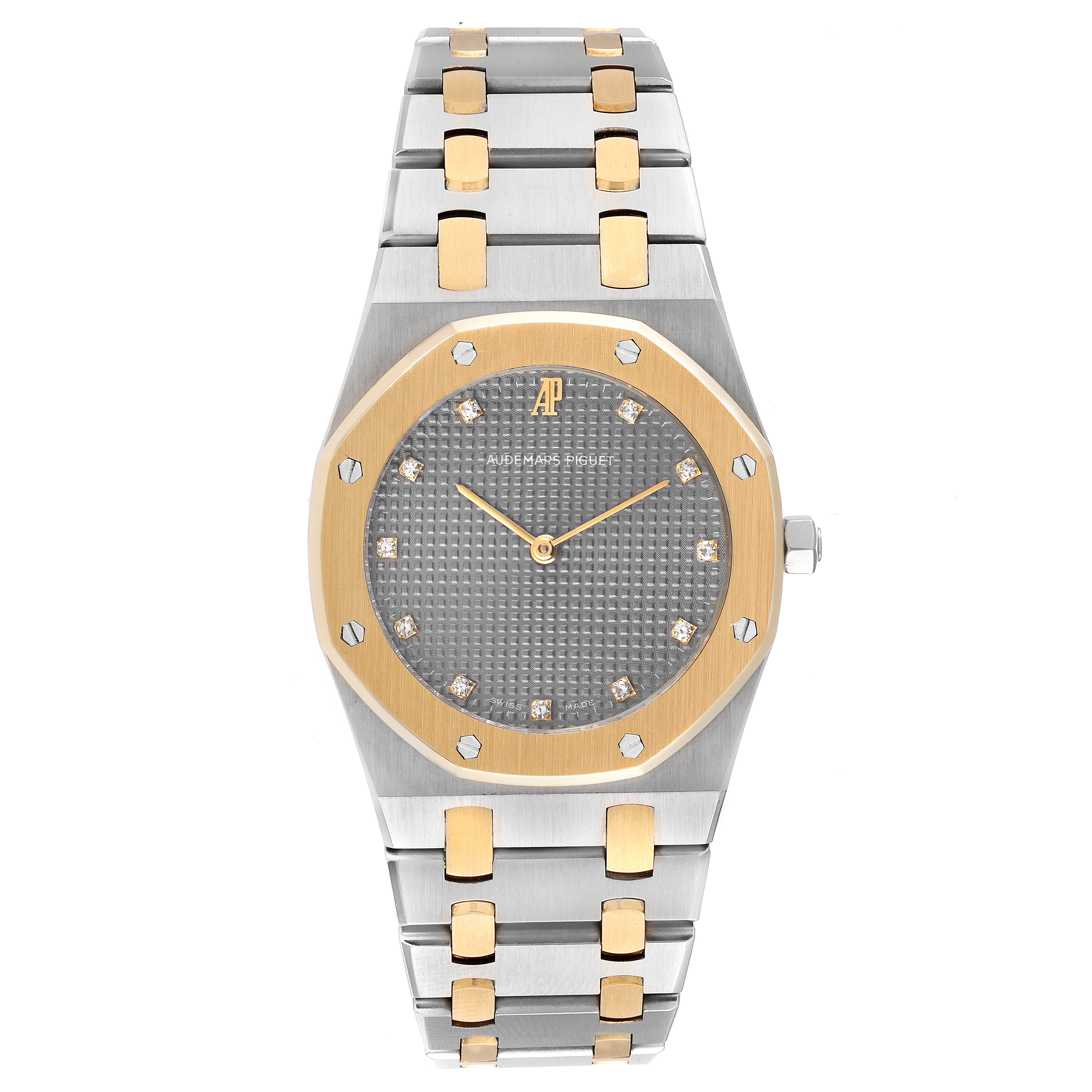 The image shows a front view of an Audemars Piguet Royal Oak 56303SA Men's Steel and Gold (two tone) Grey Dial 56303SA Men's Steel and Gold (two tone) Grey Dial watch with a gold bezel and two-tone bracelet.