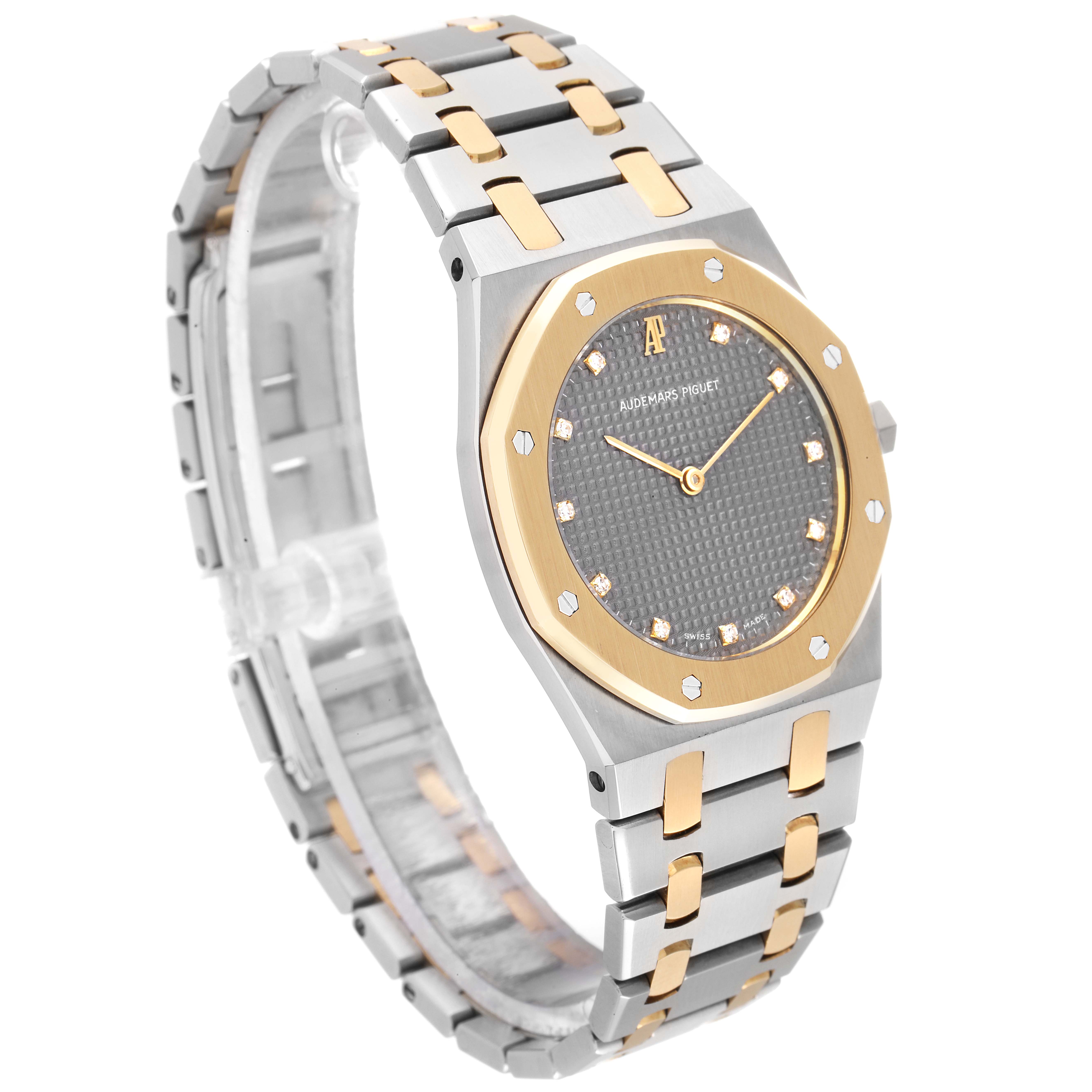 The image shows the Royal Oak model by Audemars Piguet from a front-side angle, featuring the watch face and bracelet.