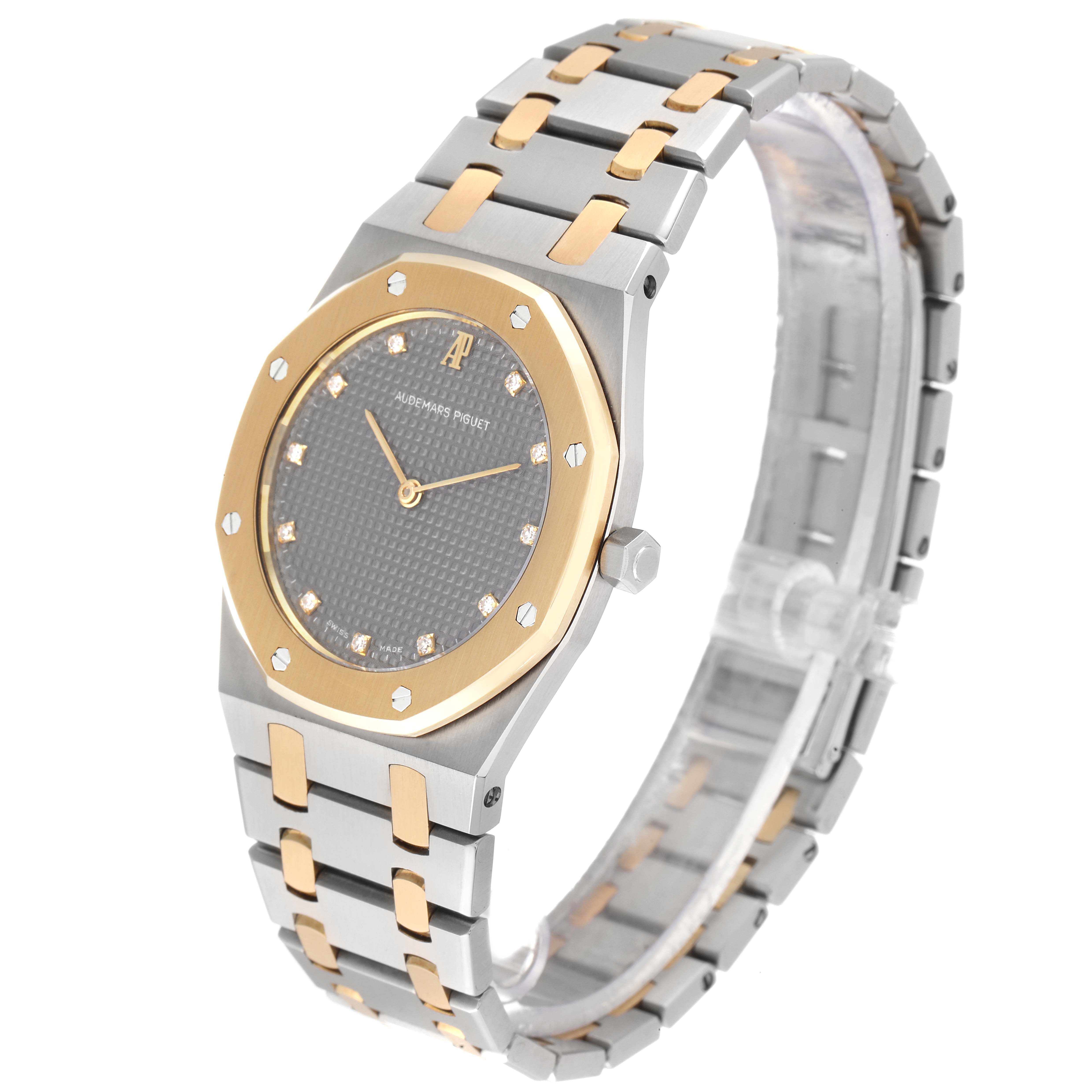 This image shows a side-angle view of the Audemars Piguet Royal Oak 56303SA Men's Steel and Gold (two tone) Grey Dial 56303SA Men's Steel and Gold (two tone) Grey Dial watch, highlighting its bracelet, case, and bezel.