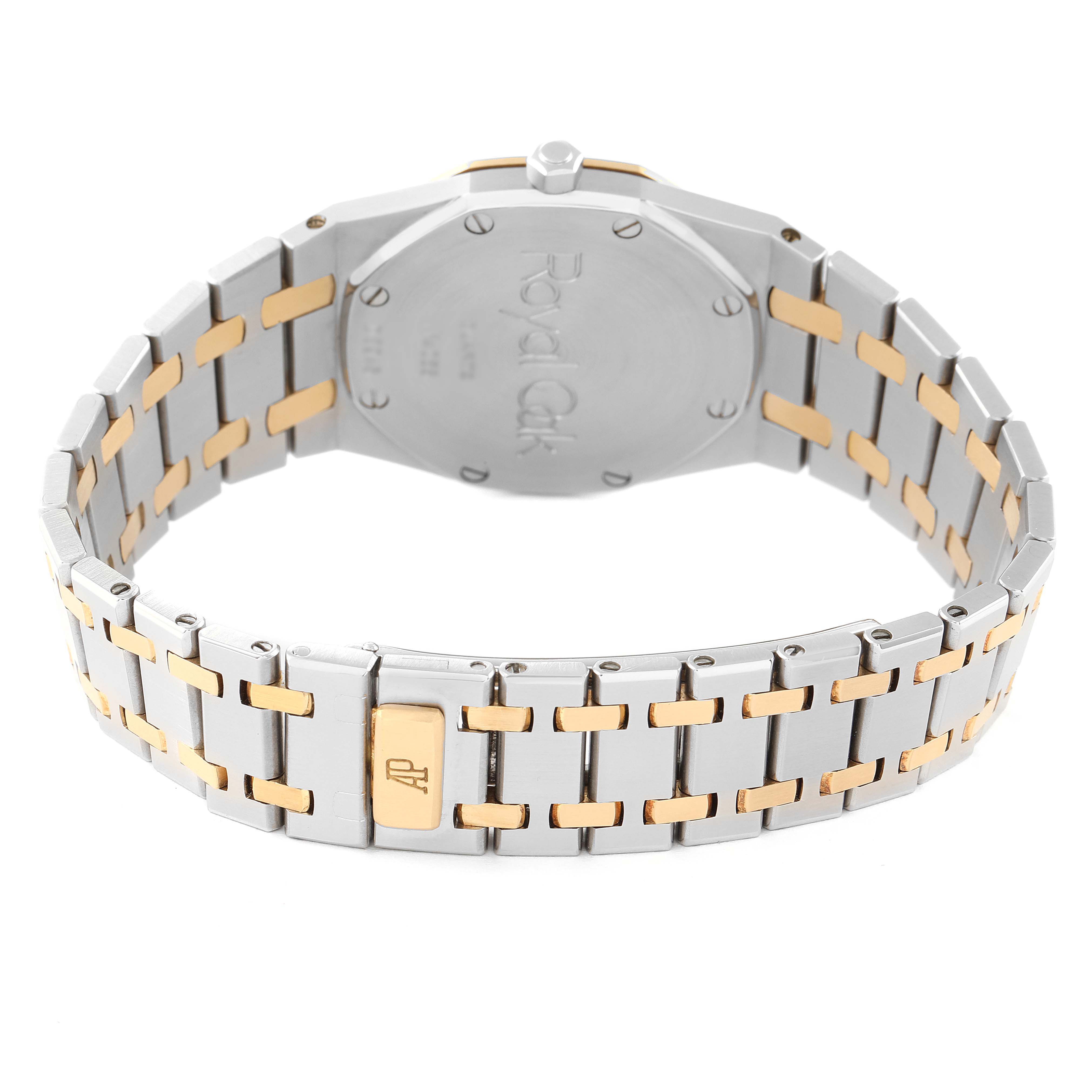 The image shows the back view of an Audemars Piguet Royal Oak 56303SA Men's Steel and Gold (two tone) Grey Dial 56303SA Men's Steel and Gold (two tone) Grey Dial watch, focusing on the stainless steel and gold bracelet and clasp.