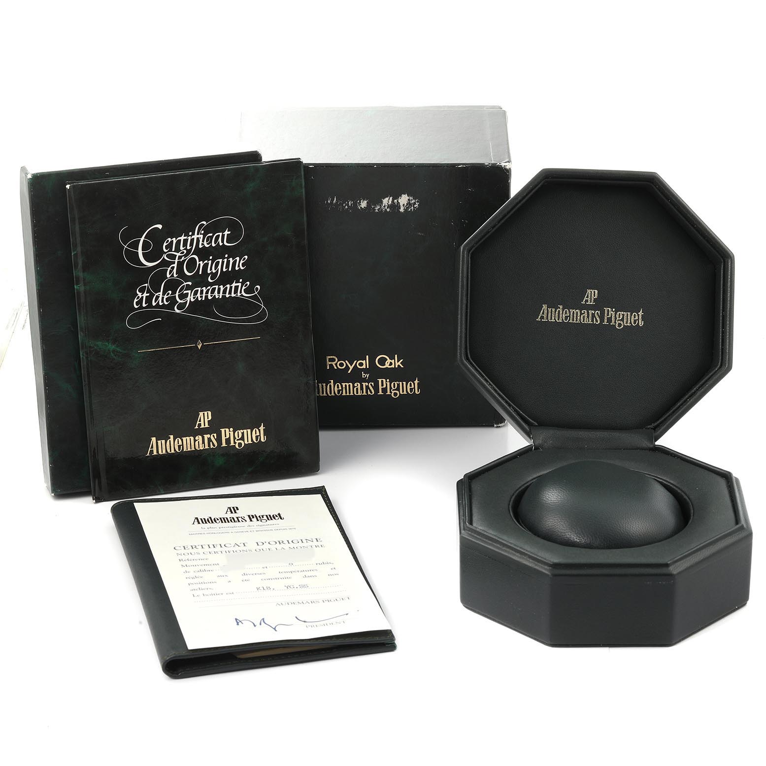 The image shows the packaging, manuals, and warranty card for an Audemars Piguet Royal Oak 56303SA Men's Steel and Gold (two tone) Grey Dial 56303SA Men's Steel and Gold (two tone) Grey Dial watch.