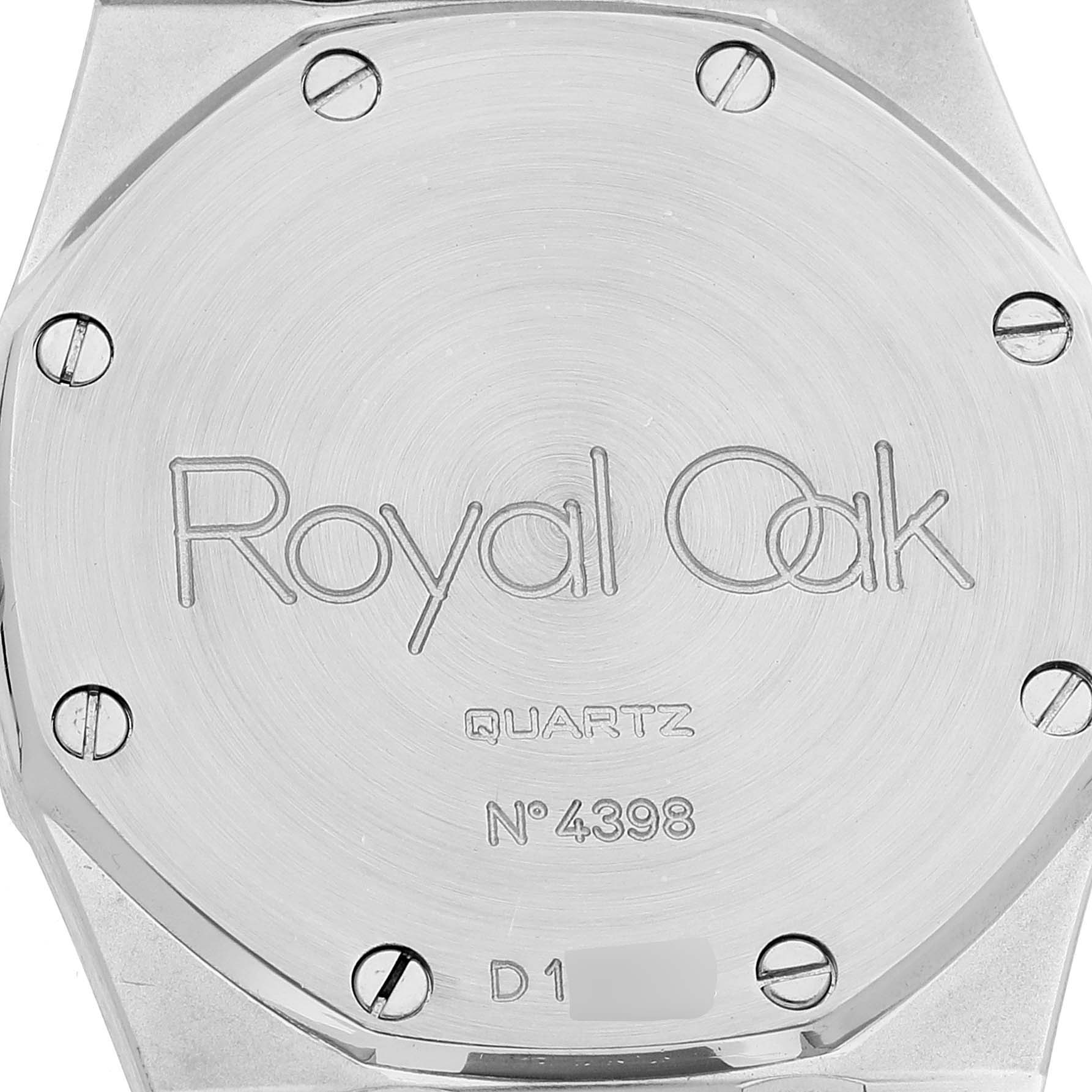 This image shows the back case of a Royal Oak watch by Audemars Piguet, highlighting its "Quartz" and serial number.